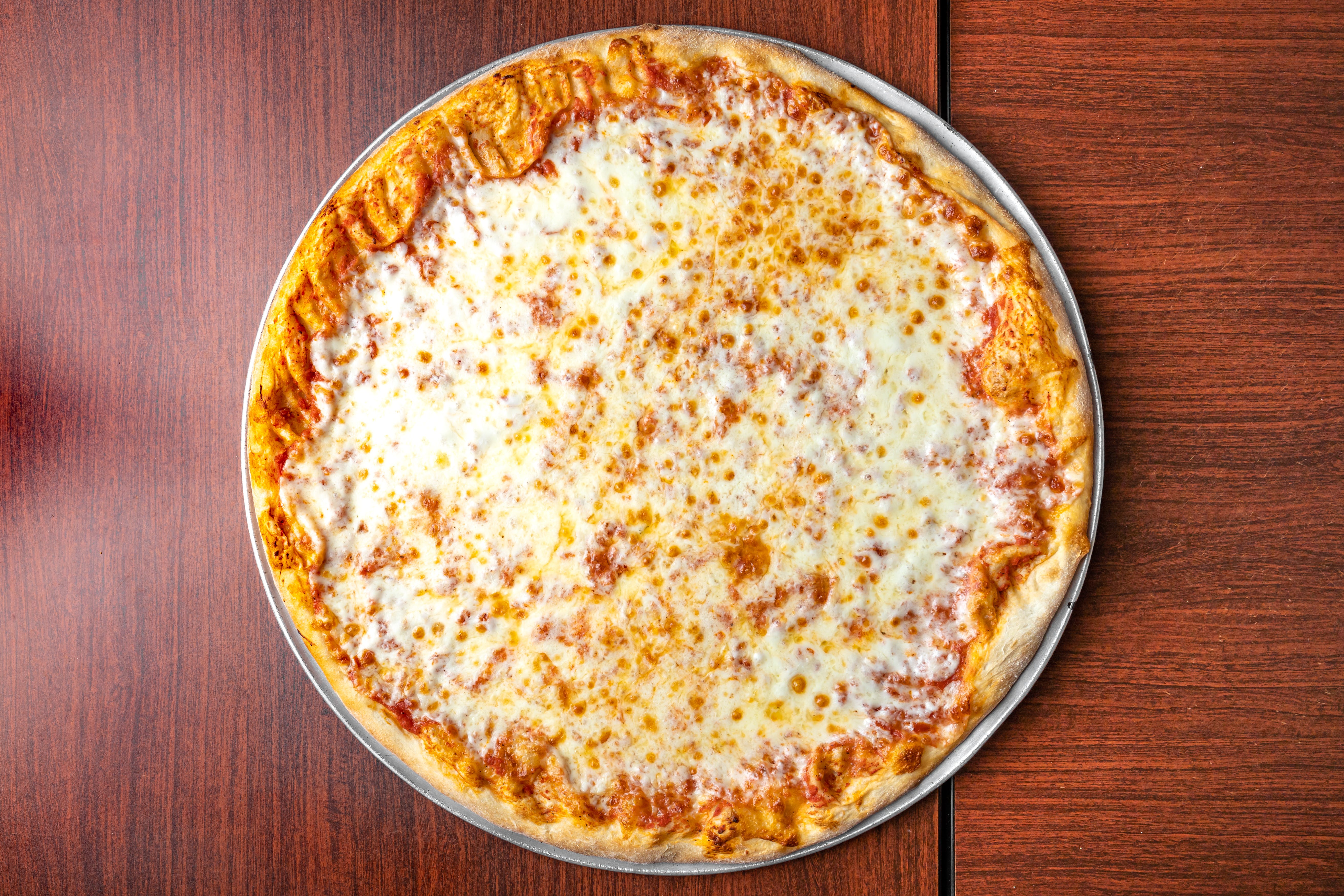 Order Regular Cheese Pizza - Personal 12'' food online from Mother Kelly's store, Syosset on bringmethat.com