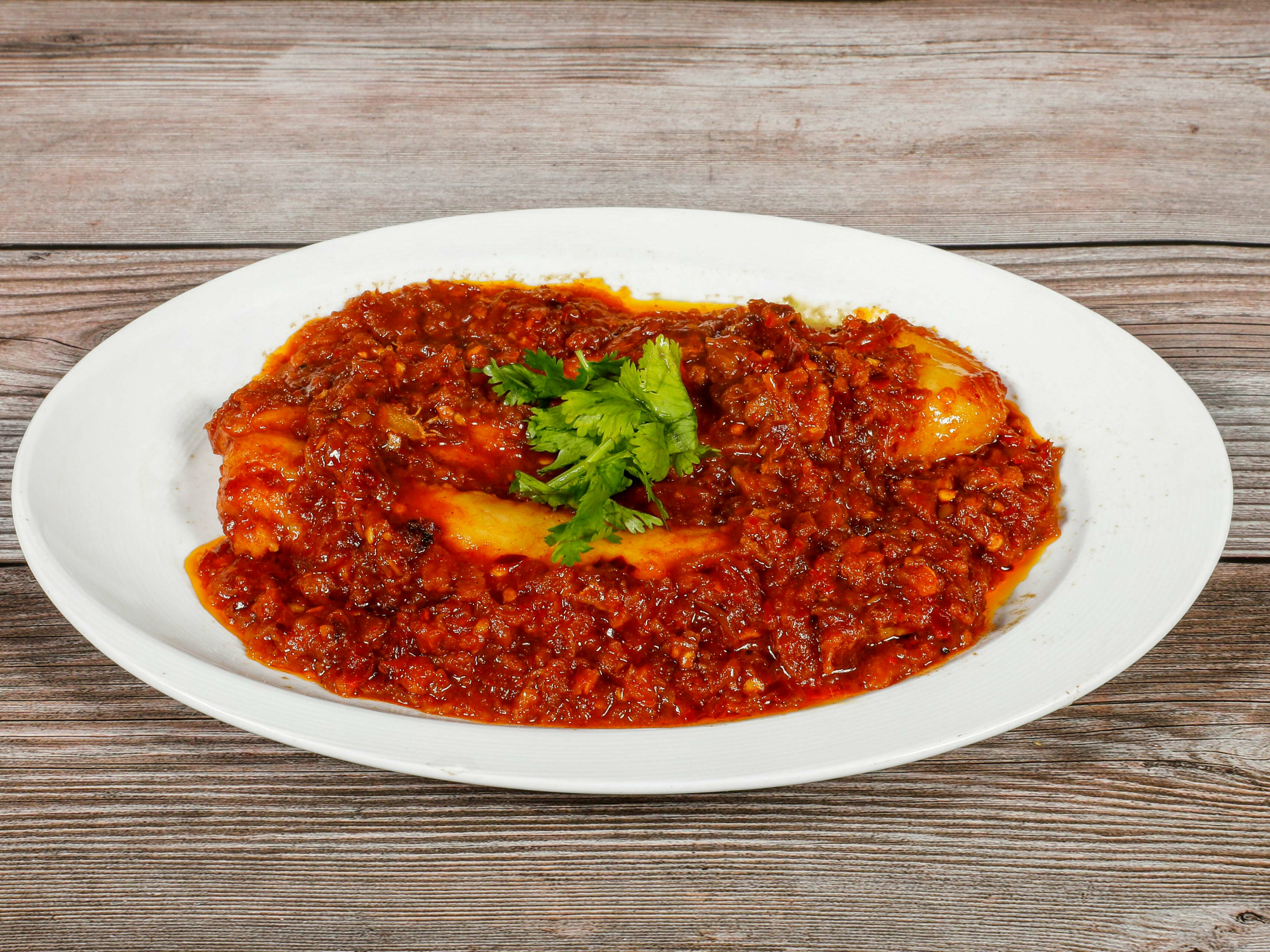 Order Spicy Fish food online from Burmese Kitchen store, San Francisco on bringmethat.com