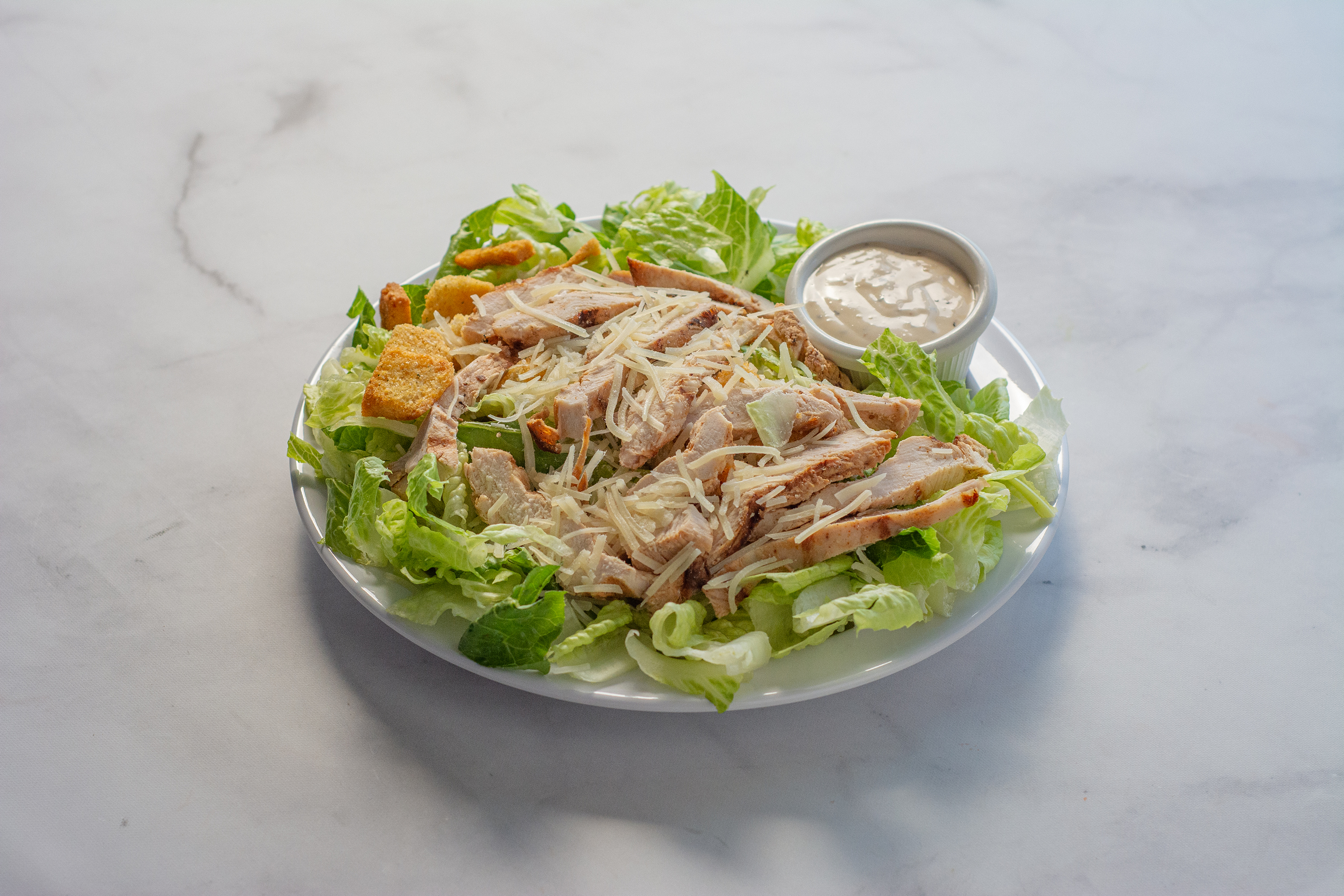 Order Grilled Chicken Caesar Salad food online from Manhattan Hub store, San Francisco on bringmethat.com
