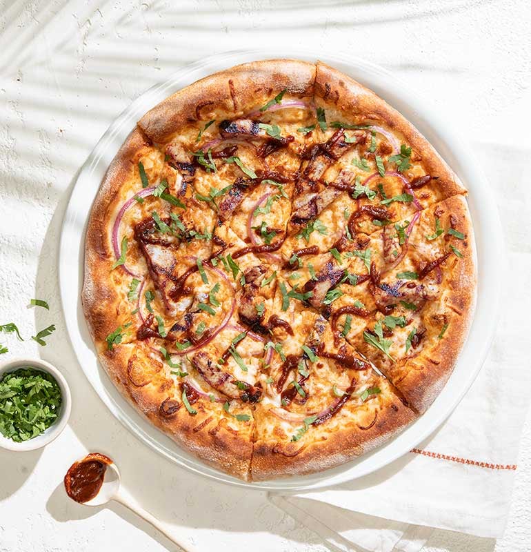 Order THE ORIGINAL BBQ CHICKEN PIZZA  food online from California Pizza Kitchen store, Hollywood on bringmethat.com