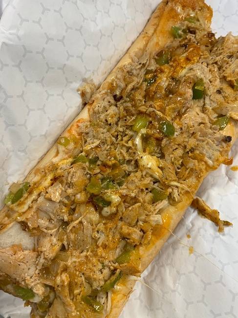 Order 12 oz Buffalo Chicken Philly Cheesesteak with peppers onions and Buffalo sauce (12oz of meat on a Amoroso roll) food online from From Philly To Charlit store, Charlotte on bringmethat.com