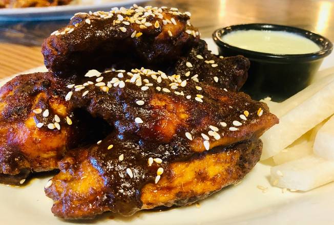 Order Mole Poblano Wings food online from Gringos & Mariachis store, Potomac on bringmethat.com