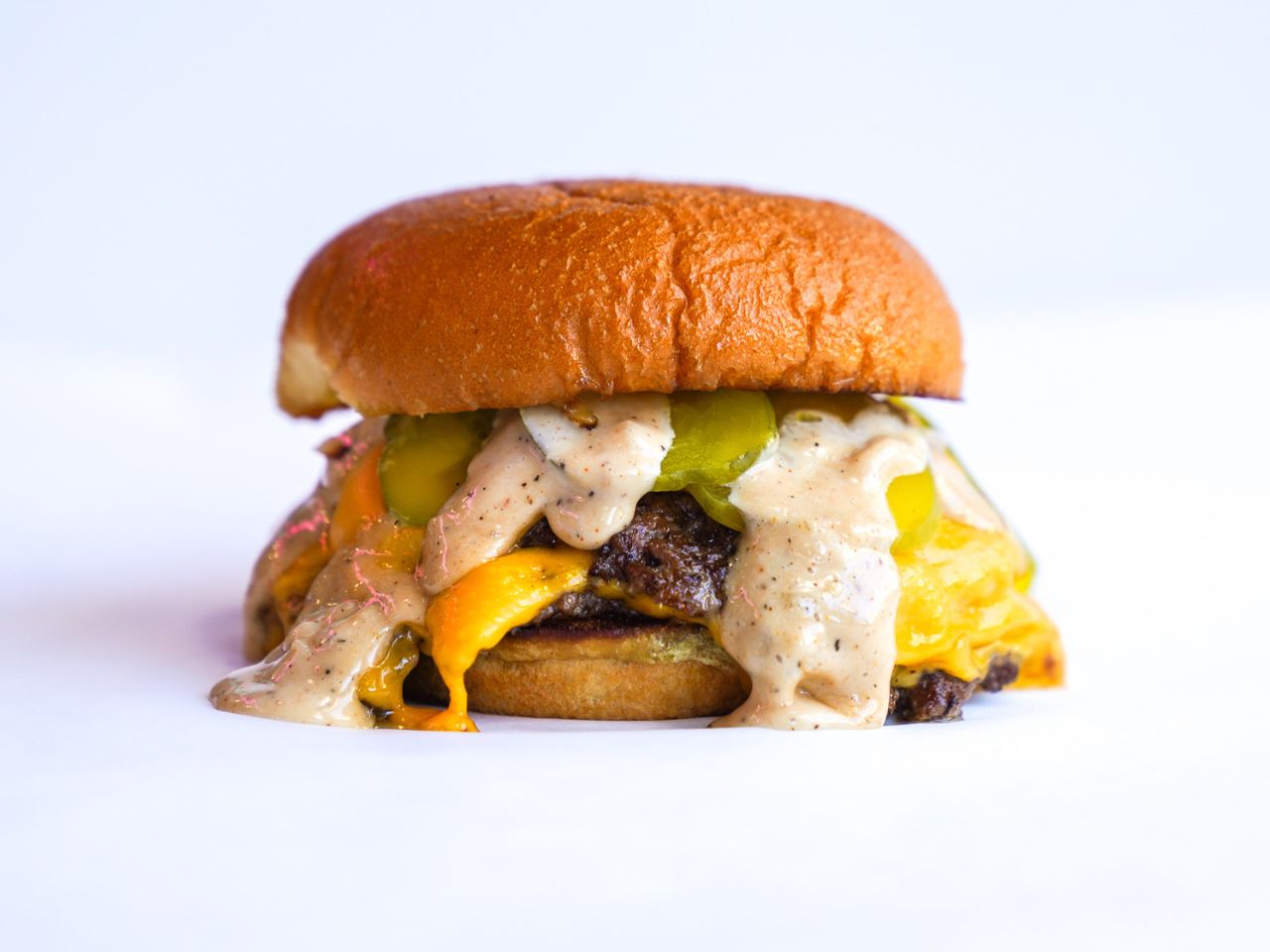 Order  Signature Smash Burger food online from Carlitos Diner store, Huntington Beach on bringmethat.com