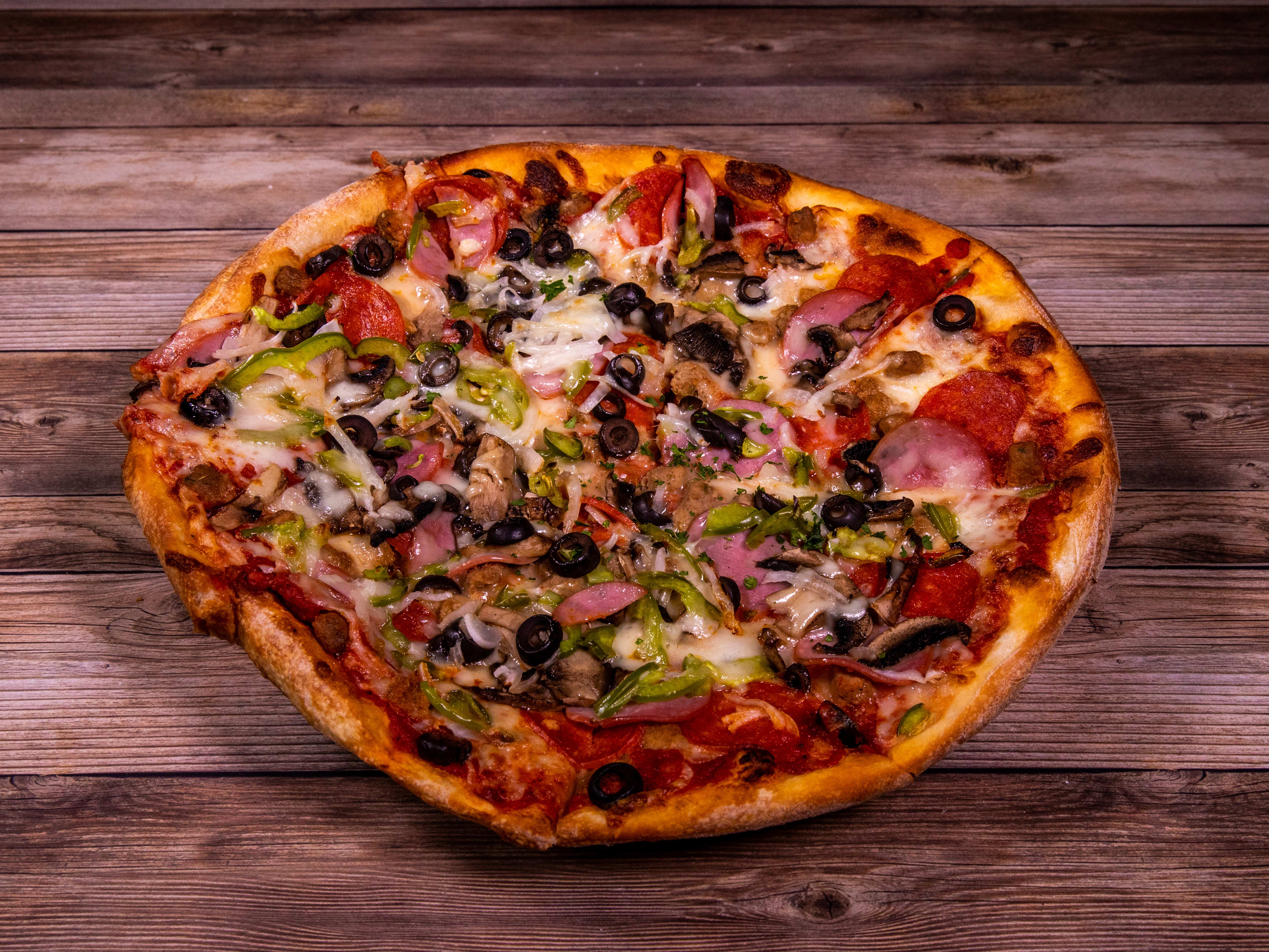 Order Supreme Pizza food online from Caprissi Pizza & Pasta store, Garland on bringmethat.com