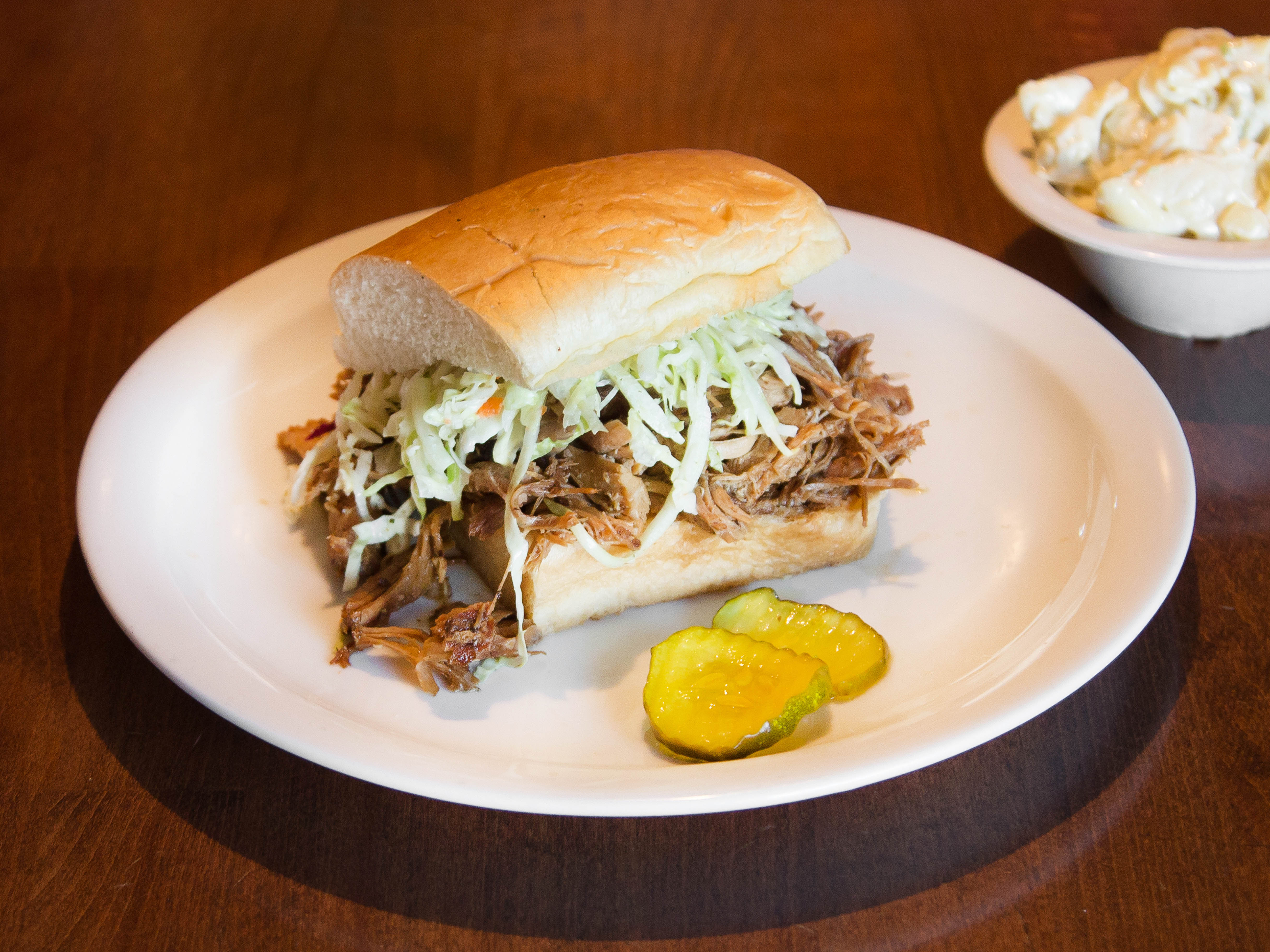 Order Pulled Pork Sandwich food online from Dr. Hogly Wogly Tyler Texas Bbq store, Panorama City on bringmethat.com