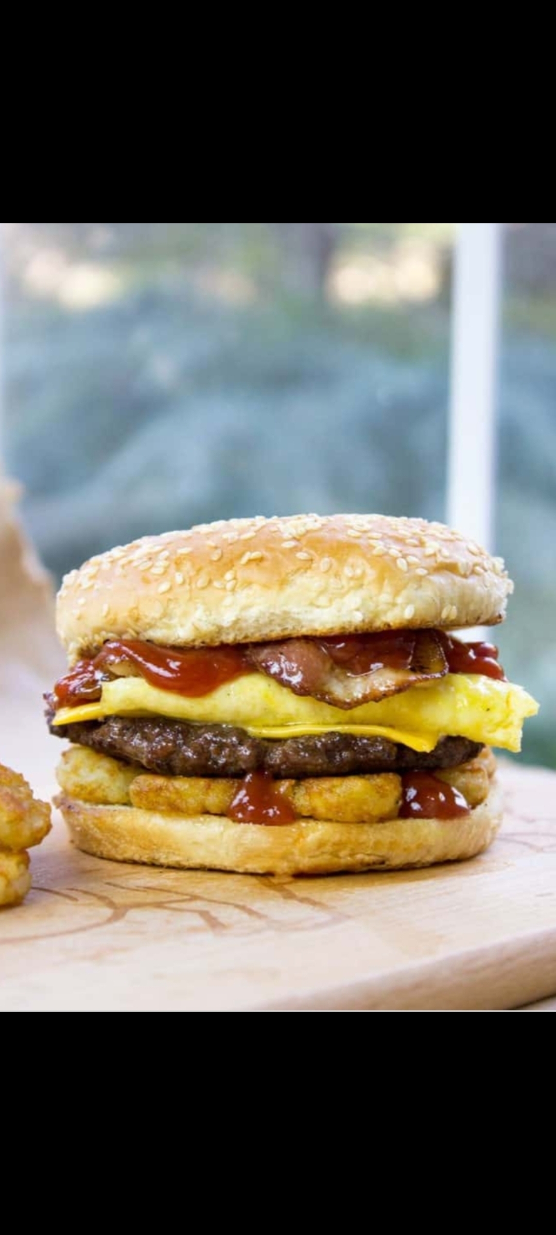 Order The BLD Burger (1/2 pounder angus beef burger,one egg,cheese, bacon & hash brown) food online from American Gourmet Foods Deli store, New York on bringmethat.com