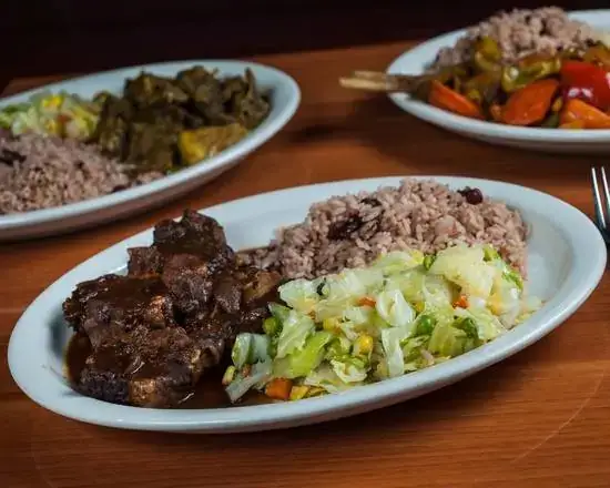 Order Organic Large Oxtail Plate food online from Footprints Jamaican Restaurant & Lounge store, Decatur on bringmethat.com