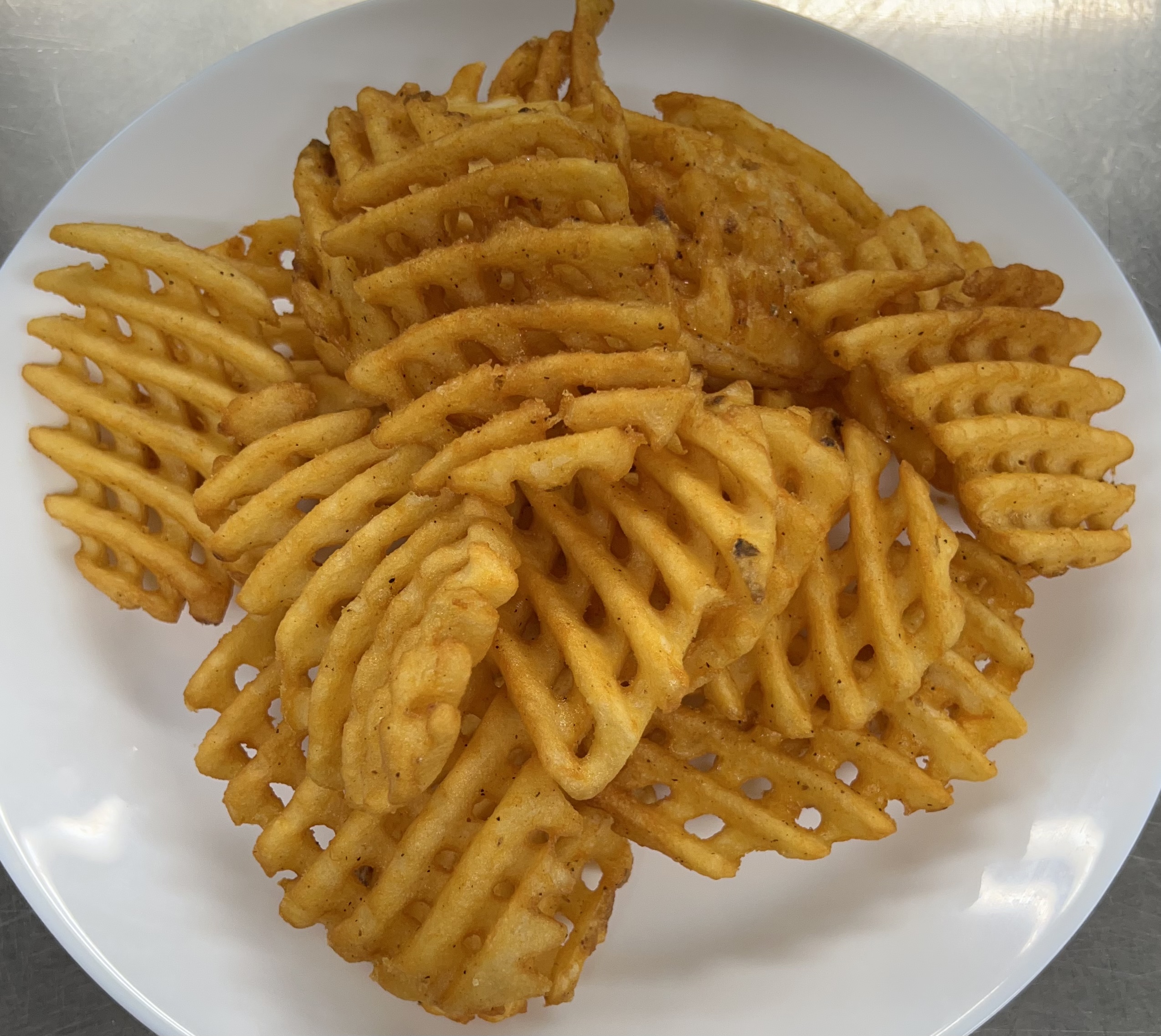 Order Seasoned Criss Cut Fries food online from Cappuccino Cafe store, Brooklyn on bringmethat.com