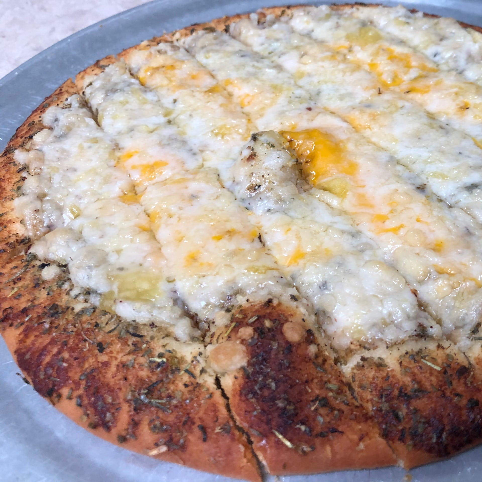 Order 3 Cheese Garlic Bread Pizza - 10'' food online from Pythagoras store, Sugar Land on bringmethat.com