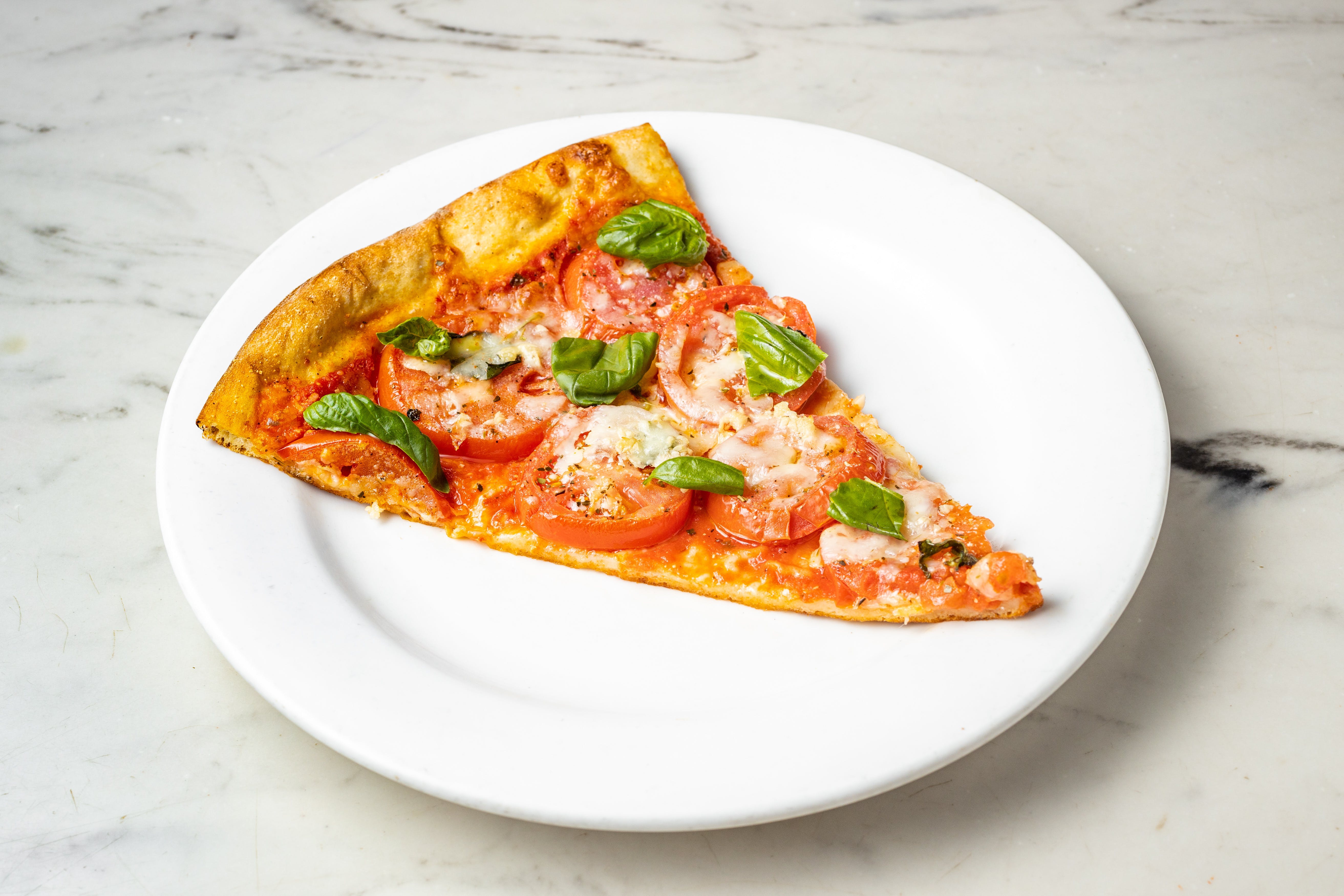 Order Tomato & Basil Pizza - Regular food online from Graziella Pizza store, Flushing on bringmethat.com