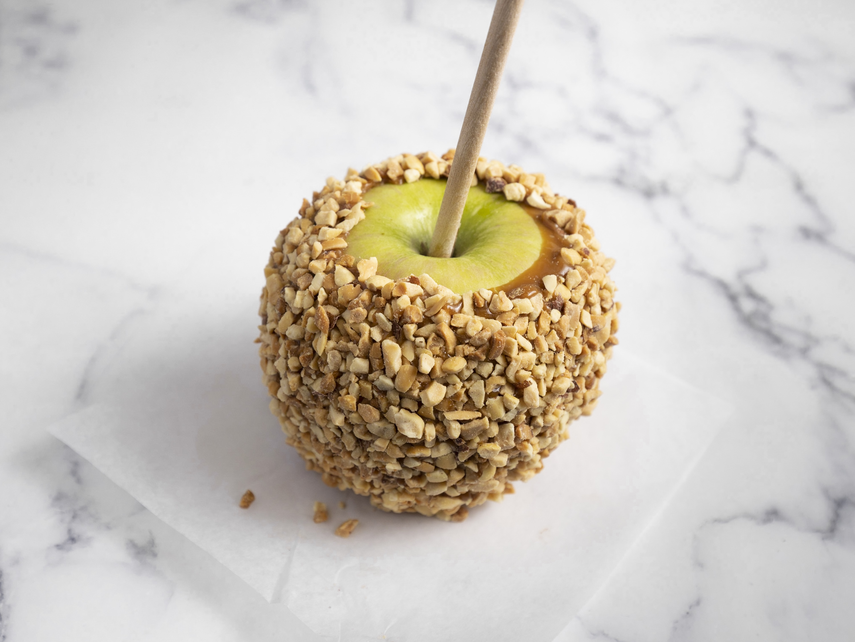 Order Caramel Apple with Peanuts food online from San Francisco Chocolate Store store, San Francisco on bringmethat.com