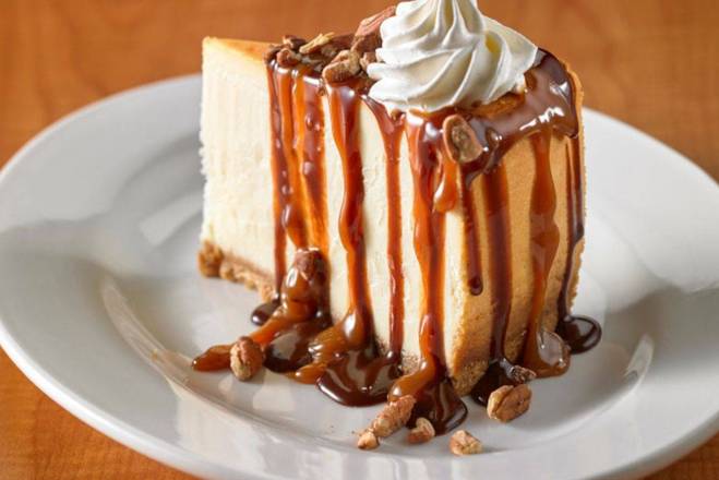 Order Slice of  Turtle Cheesecake food online from Green Mill Restaurant &Amp; Bar store, Saint Paul on bringmethat.com