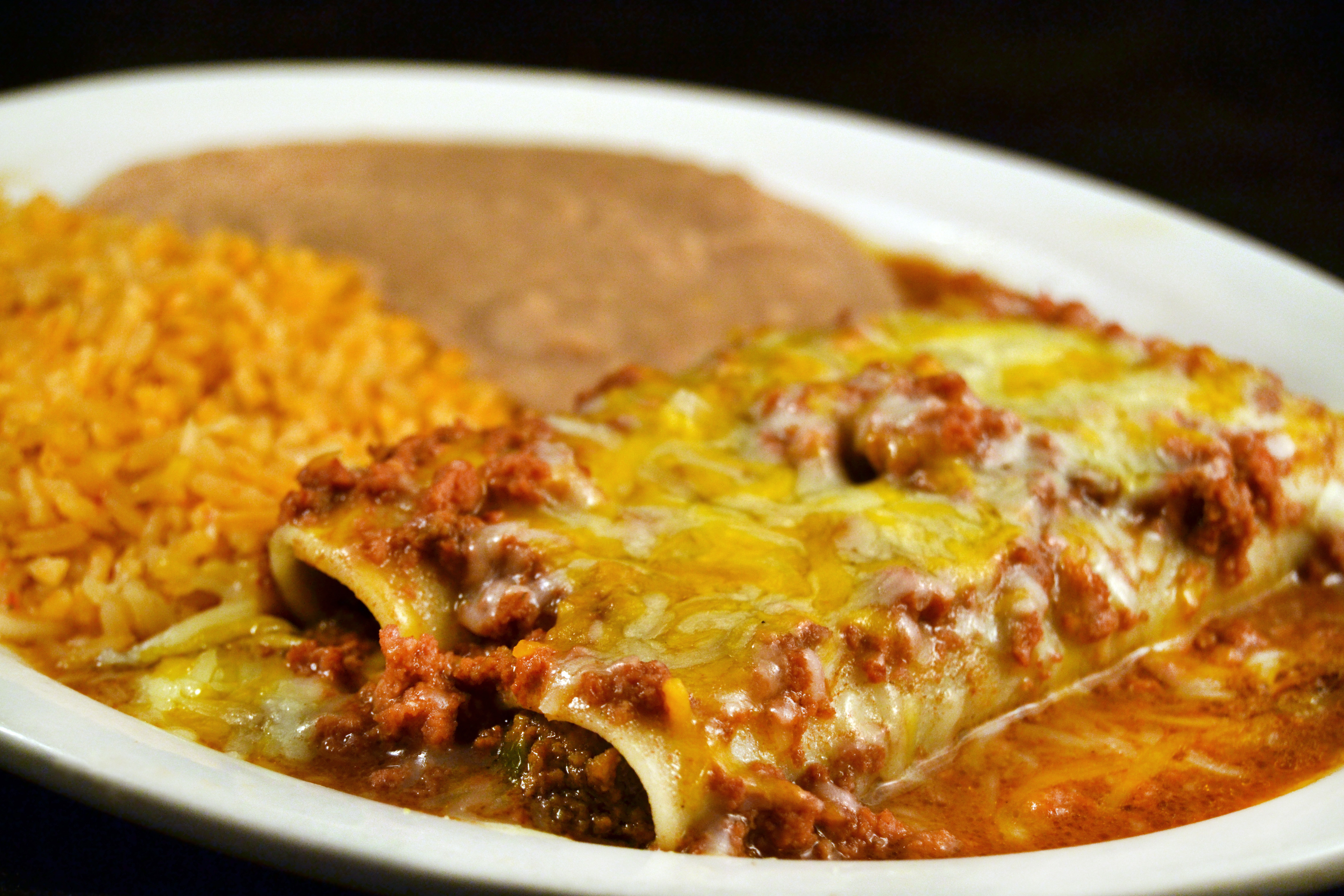 Order Chile con Carne Beef Enchiladas food online from Mi Comal Mexican Restaurant store, Irving on bringmethat.com