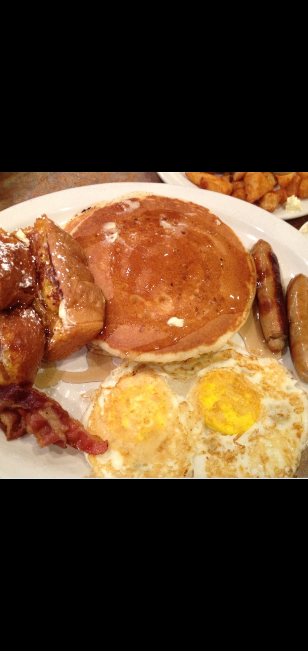 Order Better Breakfast Satisfying Meal Platter (2 eggs bacon sausage link two french toast two pancake hash browns or home fries & toast) food online from American Gourmet Foods Deli store, New York on bringmethat.com