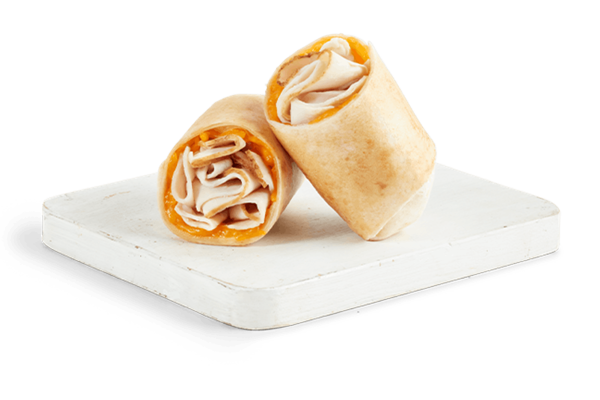 Order TURKEY & CHEDDAR WRAP food online from Tropical Smoothie Cafe store, Suwanee on bringmethat.com