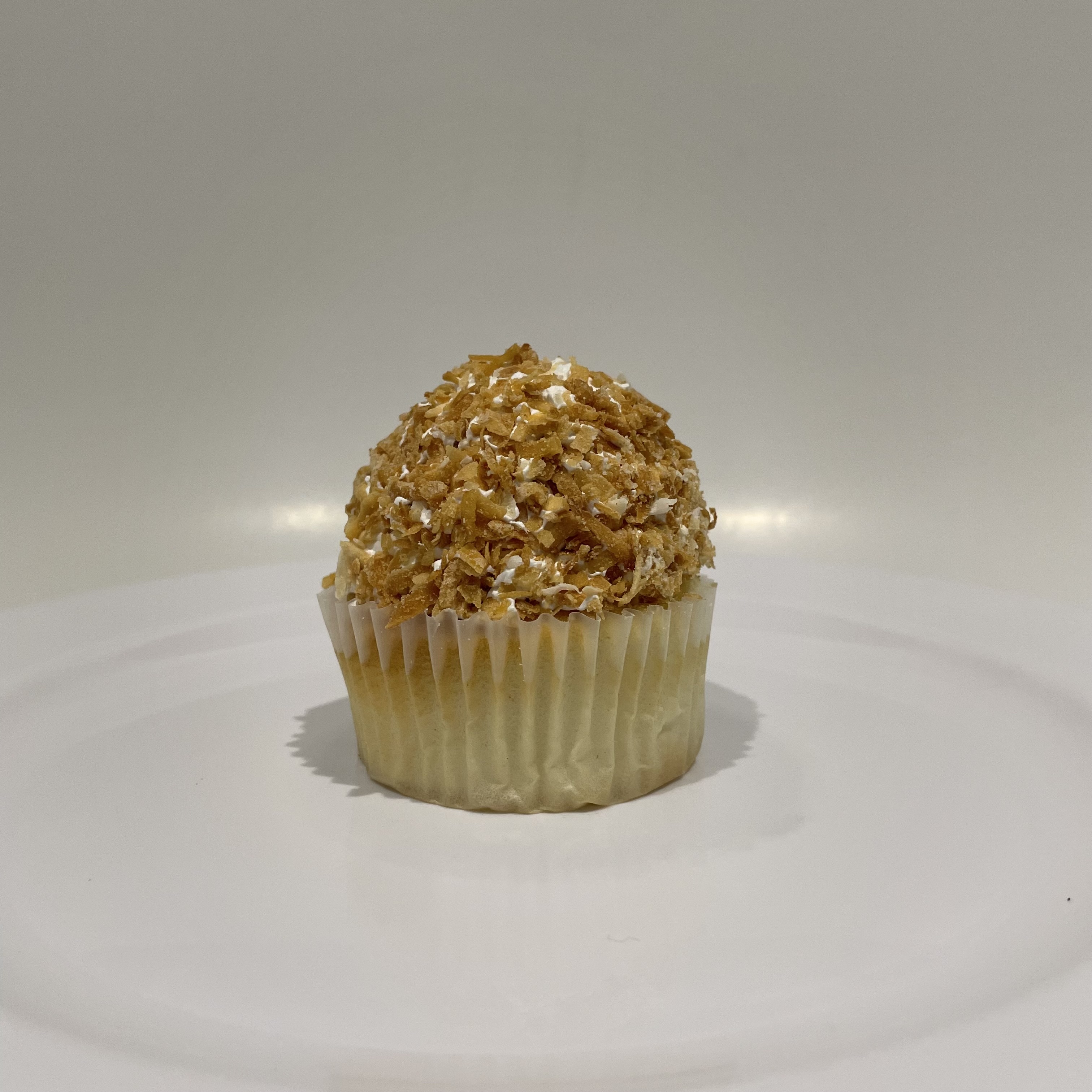 Order Coconut Custard Cupcake food online from The House of Cupcakes store, Princeton on bringmethat.com