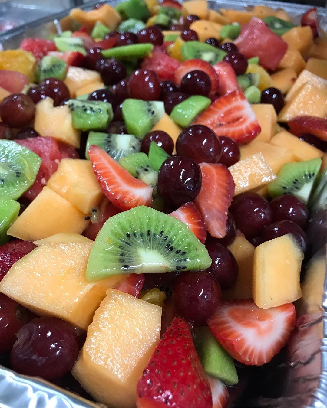 Order Fruit Salad Catering - Half food online from Planet Pizza store, Ridgefield on bringmethat.com