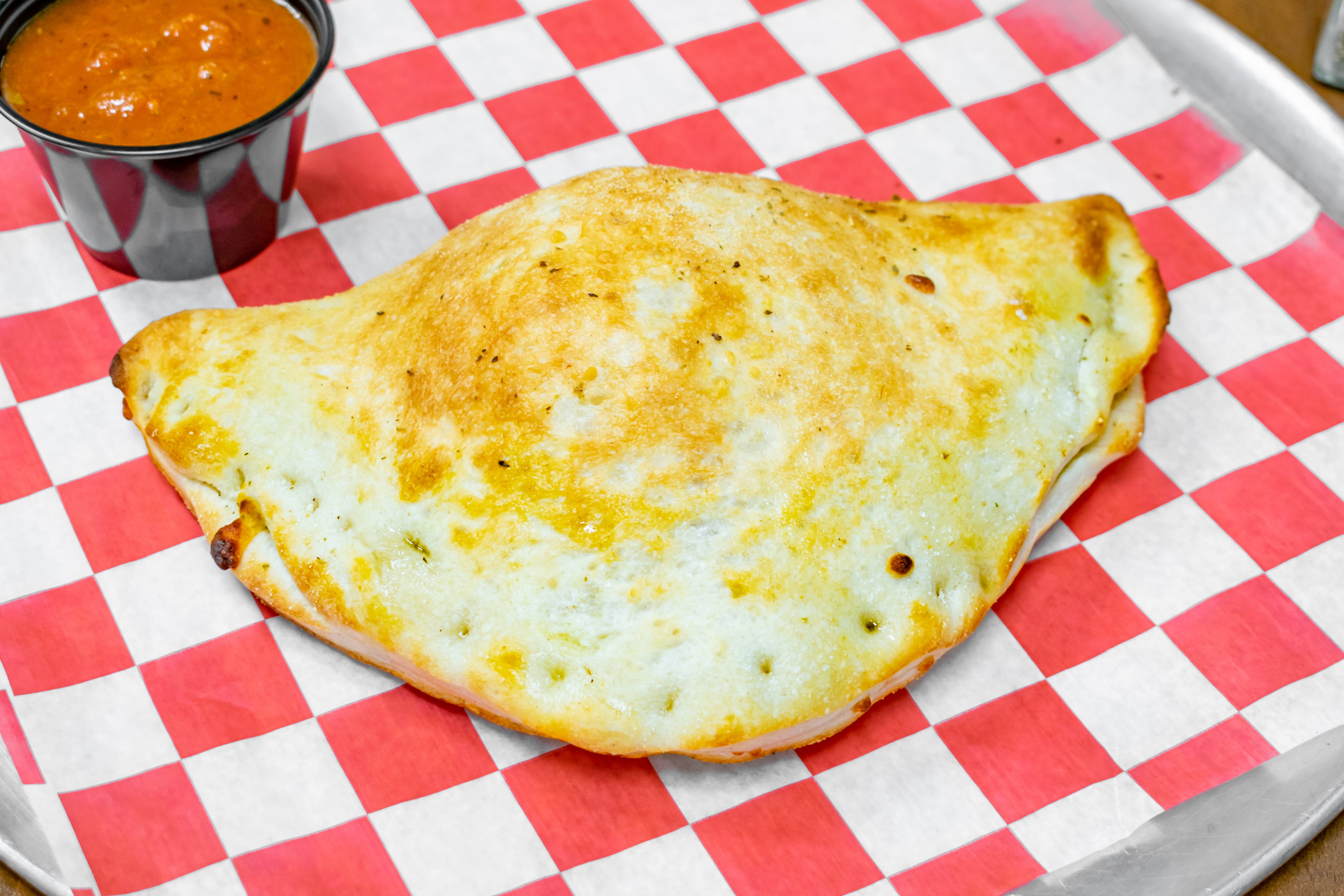 Order Cheese Calzone - Calzone food online from Brooklyn's Pizza store, Irvington on bringmethat.com