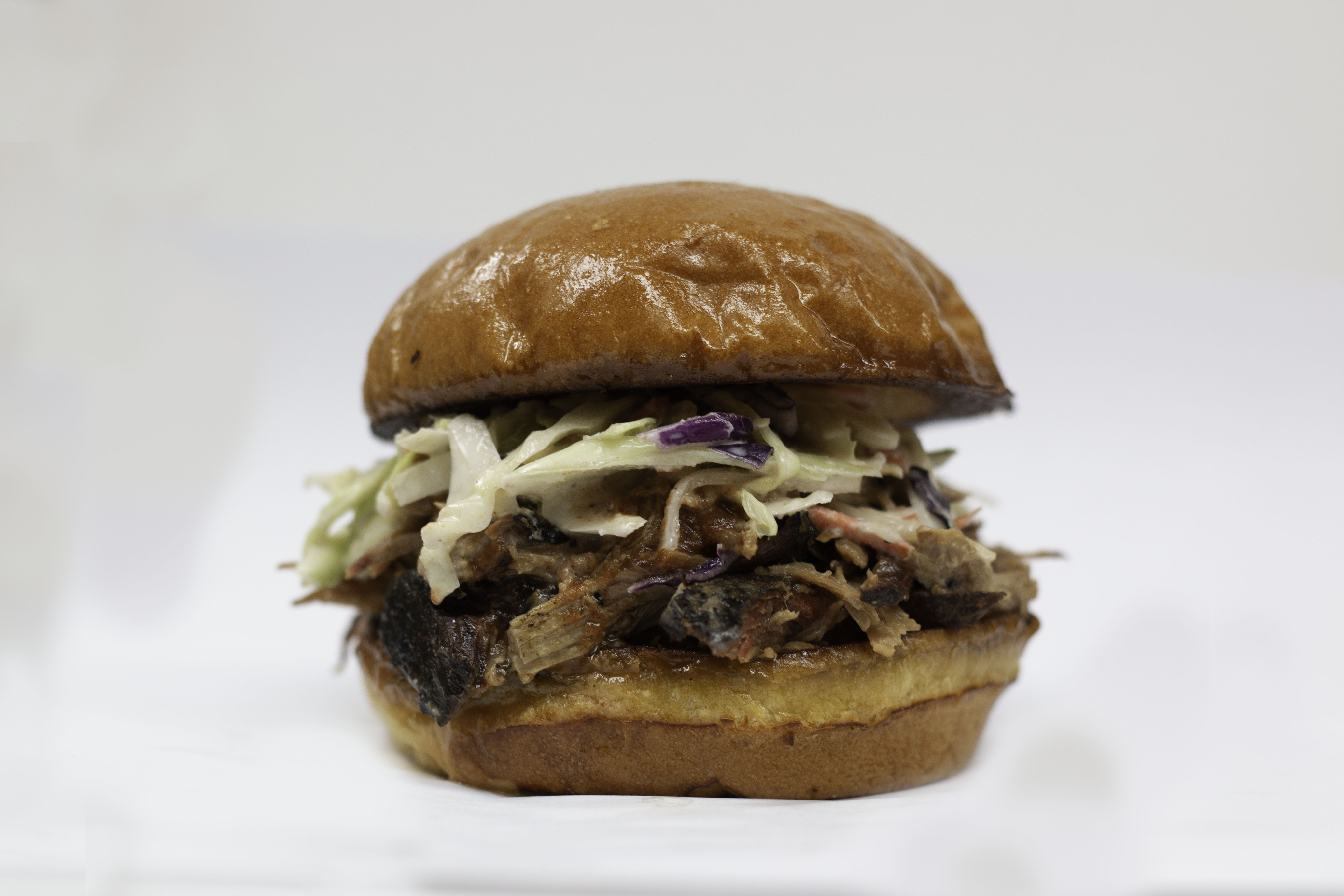 Order Pulled Pork Sandwich food online from Monti's Smokehouse BBQ store, Las Vegas on bringmethat.com
