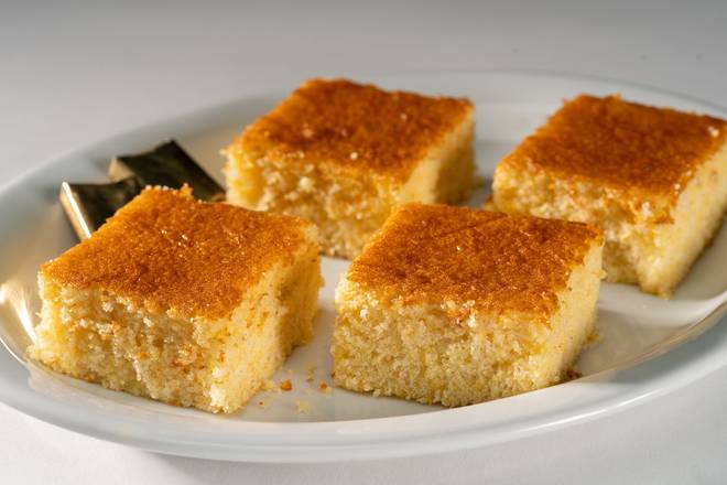Order CORNBREAD WITH BUTTER (4 pieces) food online from Glory Days Grill store, Hunter Mill on bringmethat.com