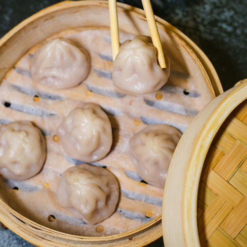 Order R6. Pork Soup Dumplings 猪肉灌汤包 food online from MomenTea store, New York on bringmethat.com