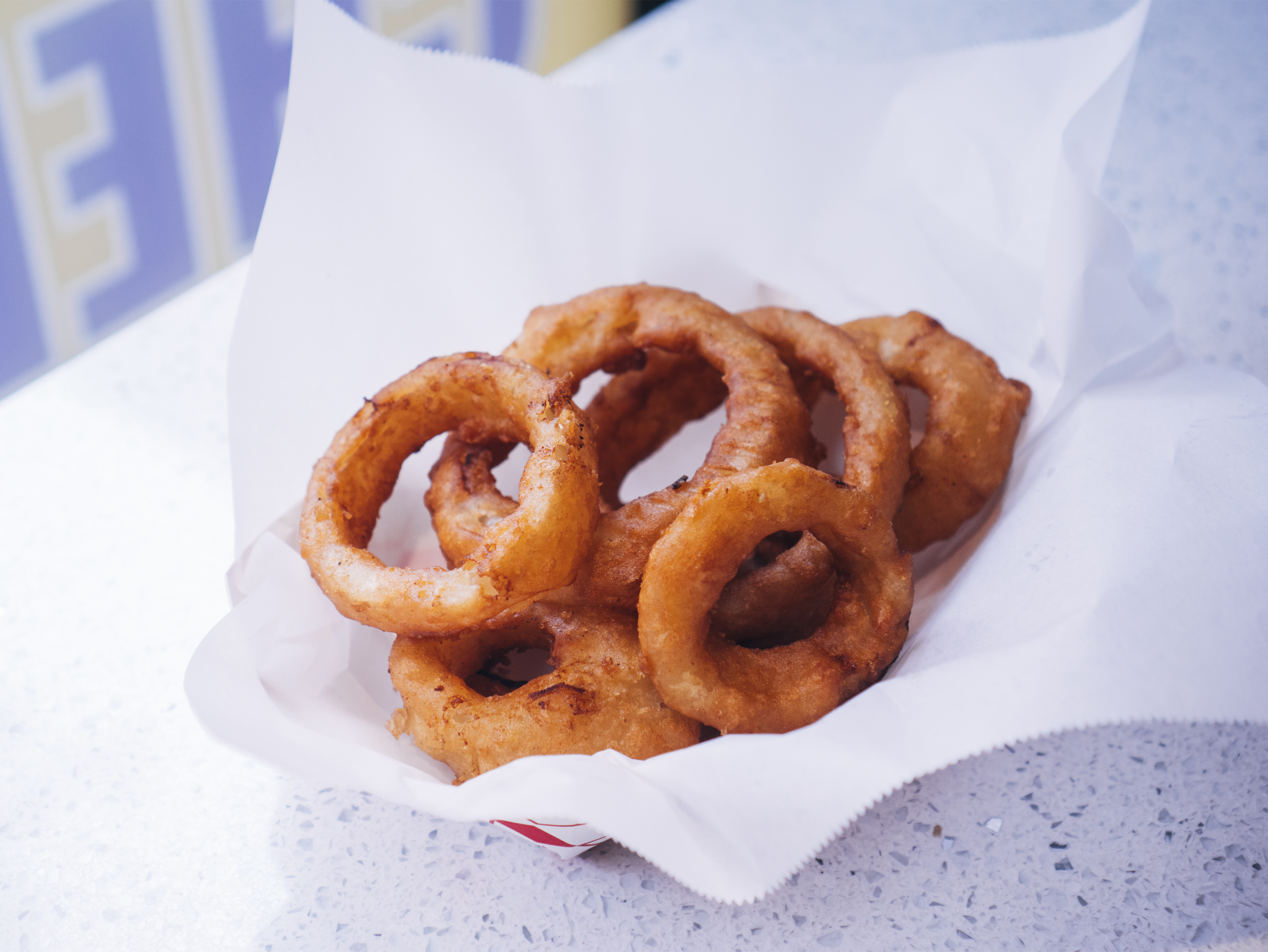 Order Basket of Onion Rings food online from Arizona Pizza Company store, Hadley on bringmethat.com