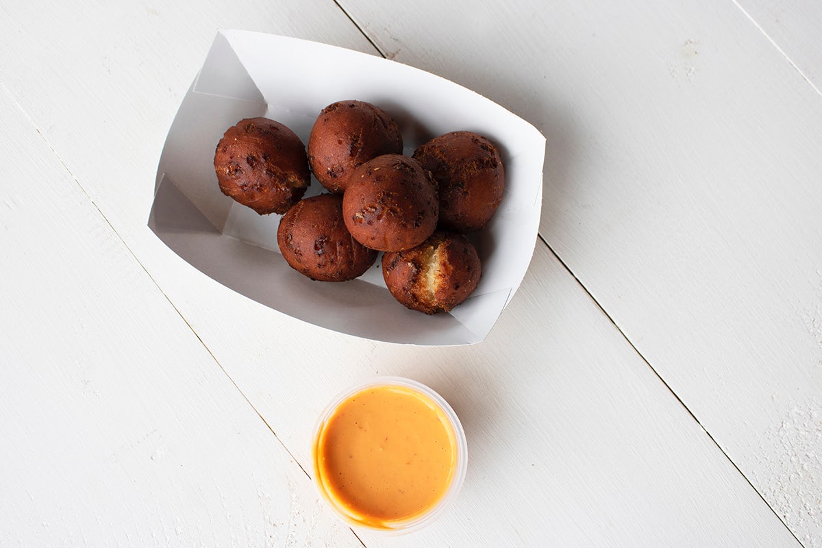 Order Cheddar & Corn Hush Puppies food online from Real Urban BBQ store, Vernon Hills on bringmethat.com