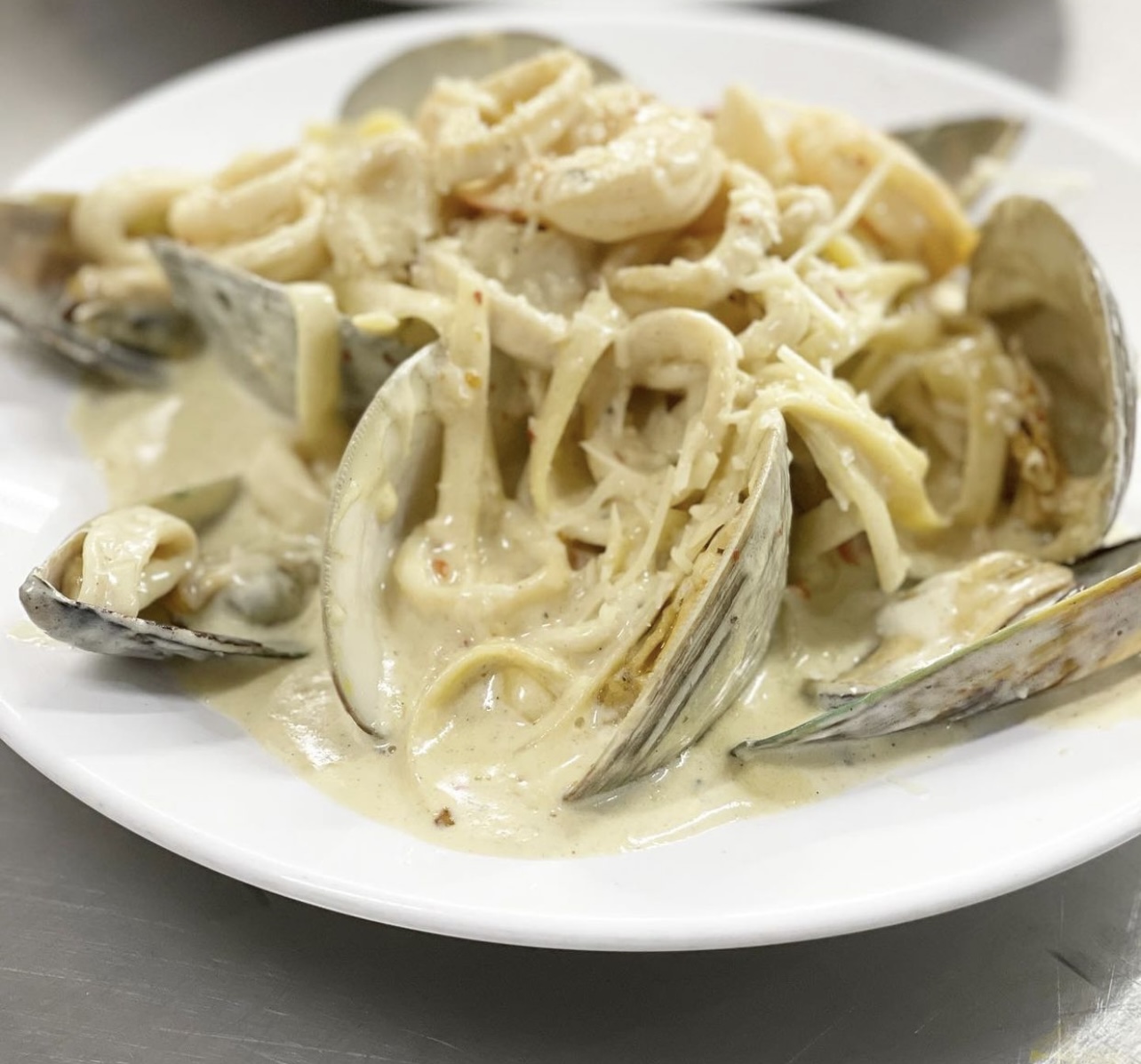 Order White Seafood pasta  food online from Red Wine Restaurant store, Philadelphia on bringmethat.com