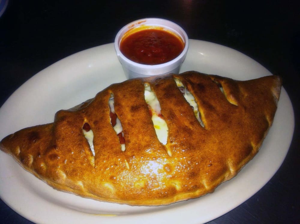 Order Chicken Calzone food online from NY Pizzeria store, Arlington on bringmethat.com