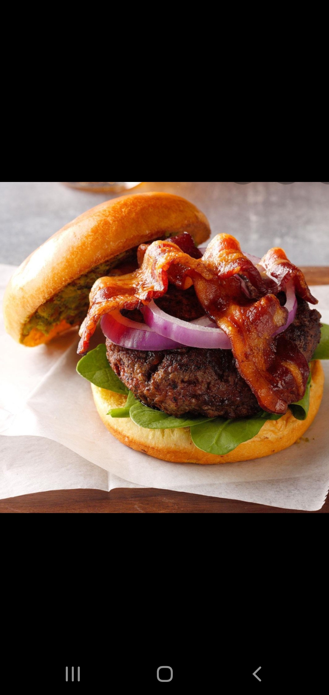 Order  1/2 Angus Beef Burger With Bacon (includes lettuce and tomatoes) food online from American Gourmet Foods Deli store, New York on bringmethat.com