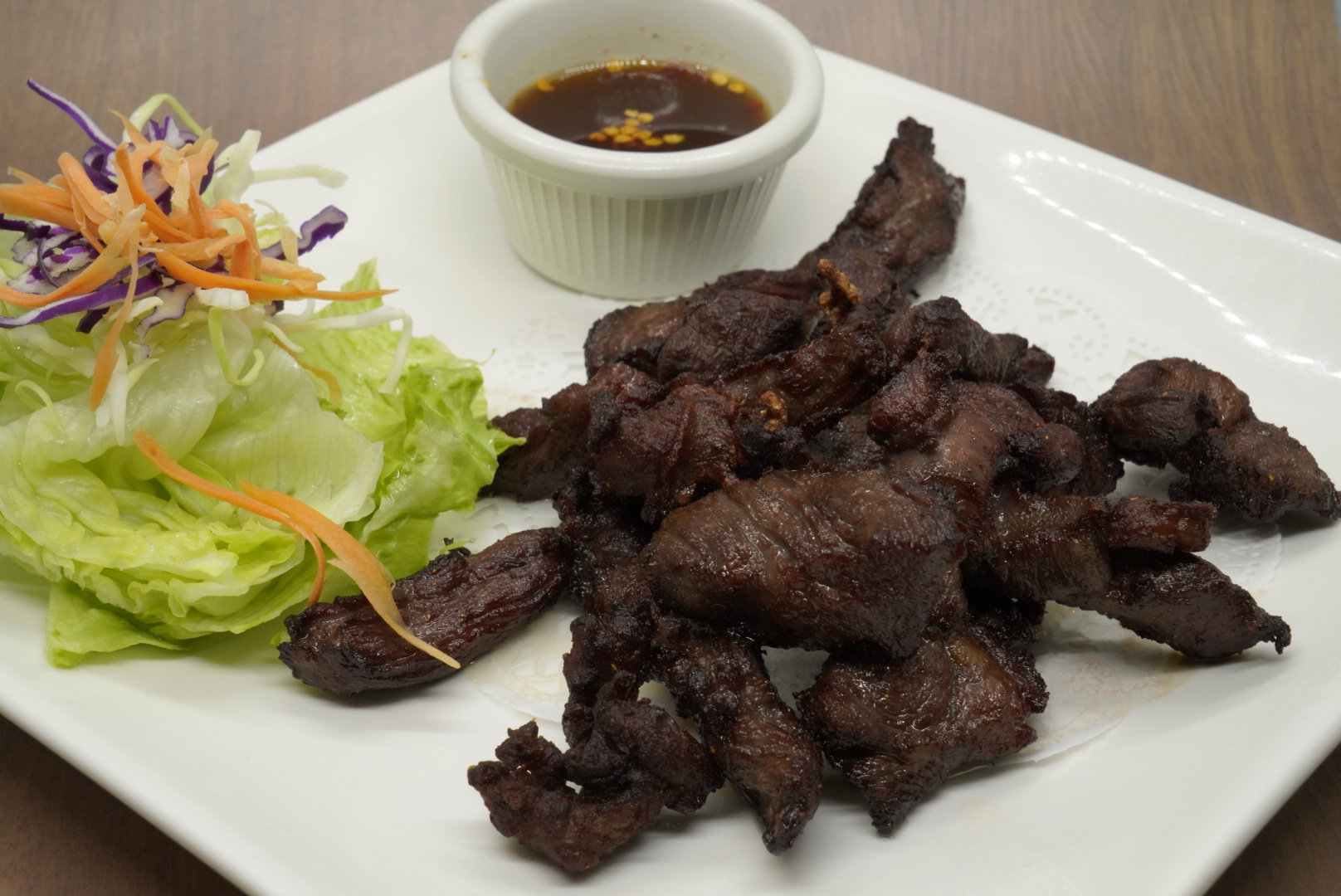 Order 36. Thai Beef Jerky food online from Royal Orchid Thai II store, Riverside on bringmethat.com
