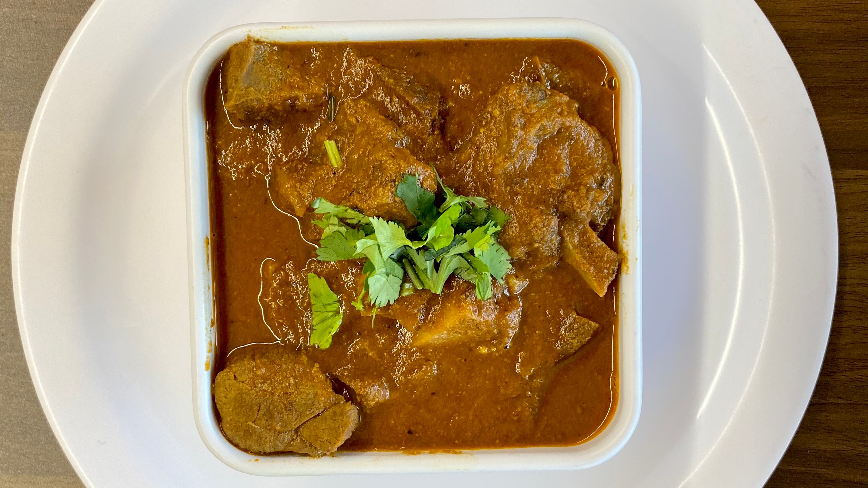 Order Goat Curry food online from Indian Cafe store, East Moline on bringmethat.com