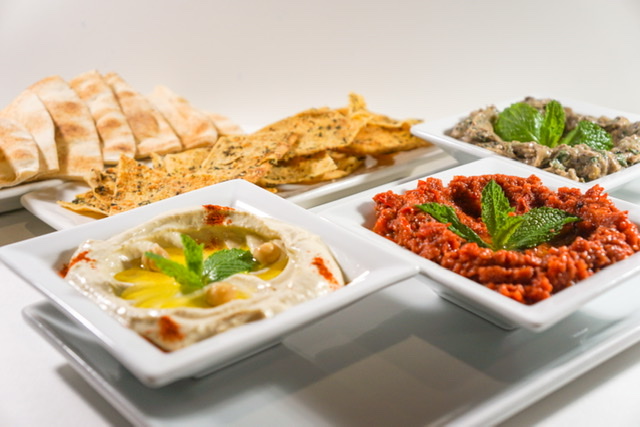 Order Hummus Dip food online from Mezza Grille store, Houston on bringmethat.com