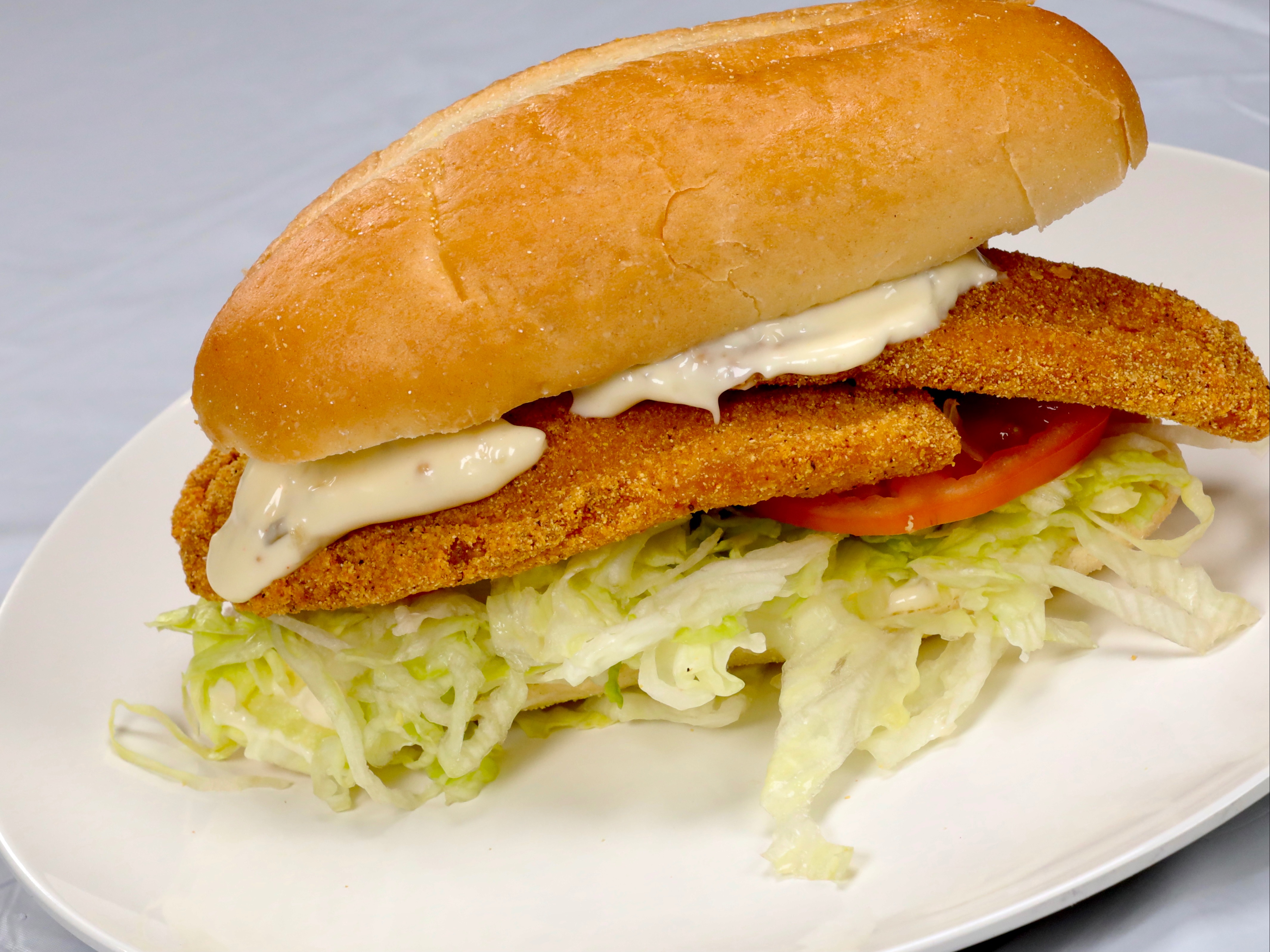 Order Tilapia Sandwich food online from Sam Sylk Chicken And Fish store, Euclid on bringmethat.com