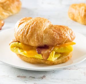 Order McMilano: Egg, cheese, & Ham or Bacon on Focaccia food online from Milano Cafe & Deli store, Burbank on bringmethat.com
