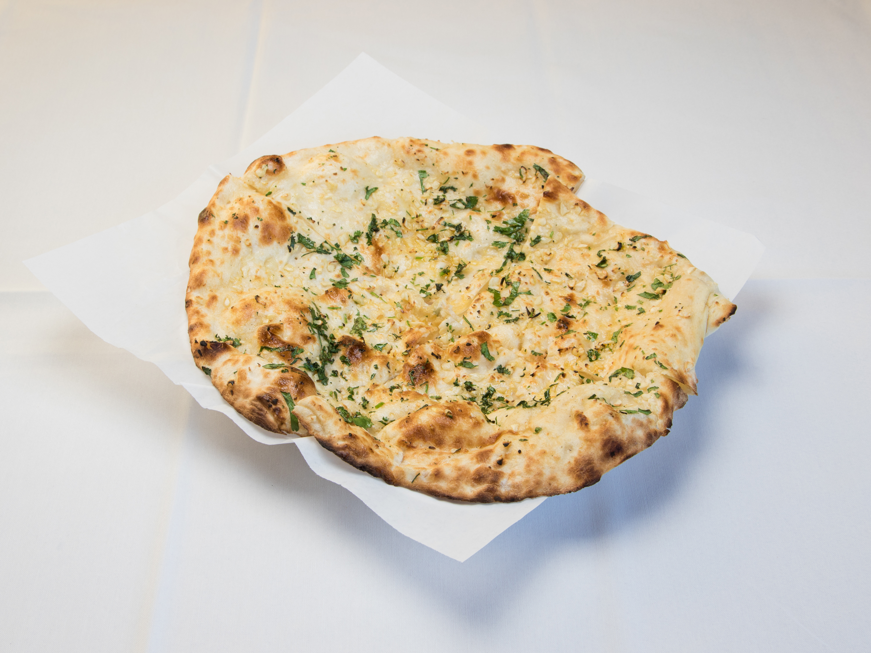 Order 2. Garlic Naan food online from Dhaba indian bistro store, Middleton on bringmethat.com