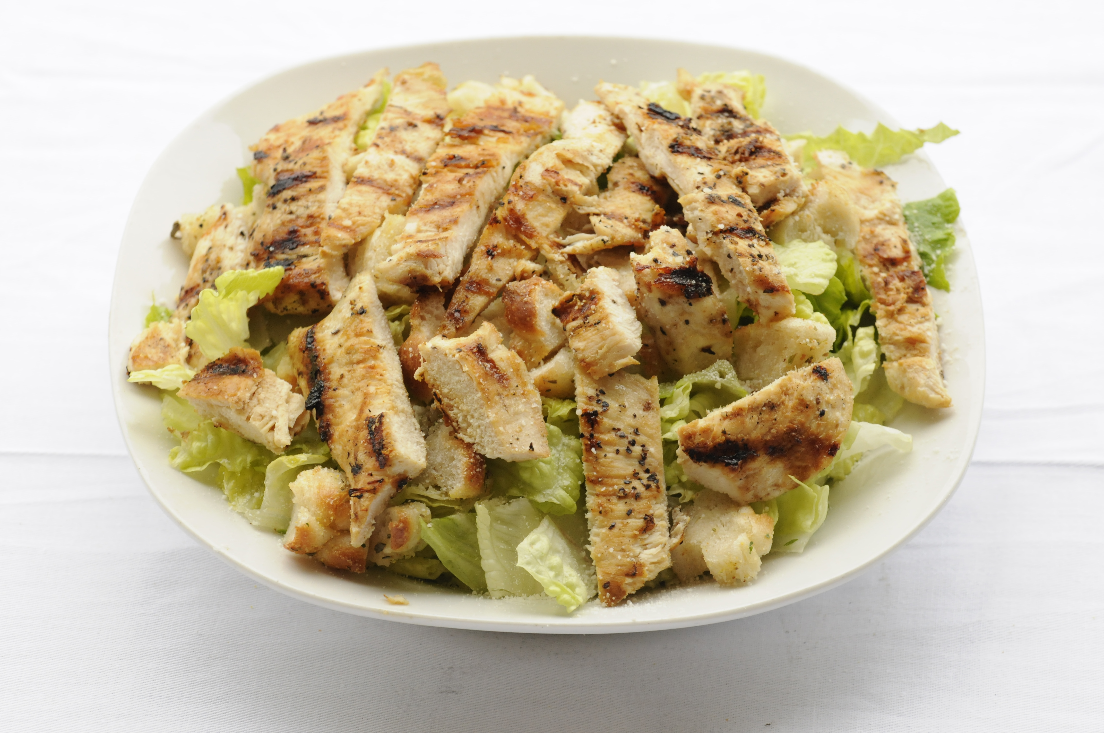 Order Grilled Chicken Caesar Salad food online from Roberto's Pizza & Pasta store, New Rochelle on bringmethat.com