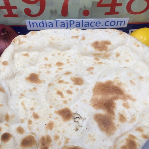 Order C8. Naan food online from India Taj Palace store, San Antonio on bringmethat.com