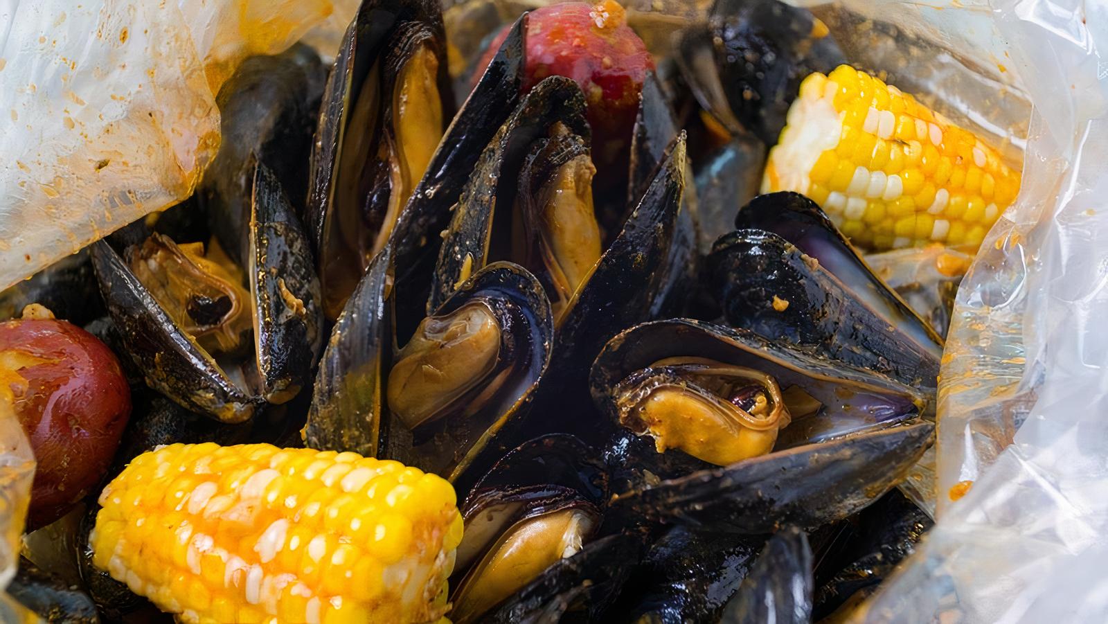 Order 1 lb Black Mussel food online from Old Town Crab store, Lawrenceville on bringmethat.com