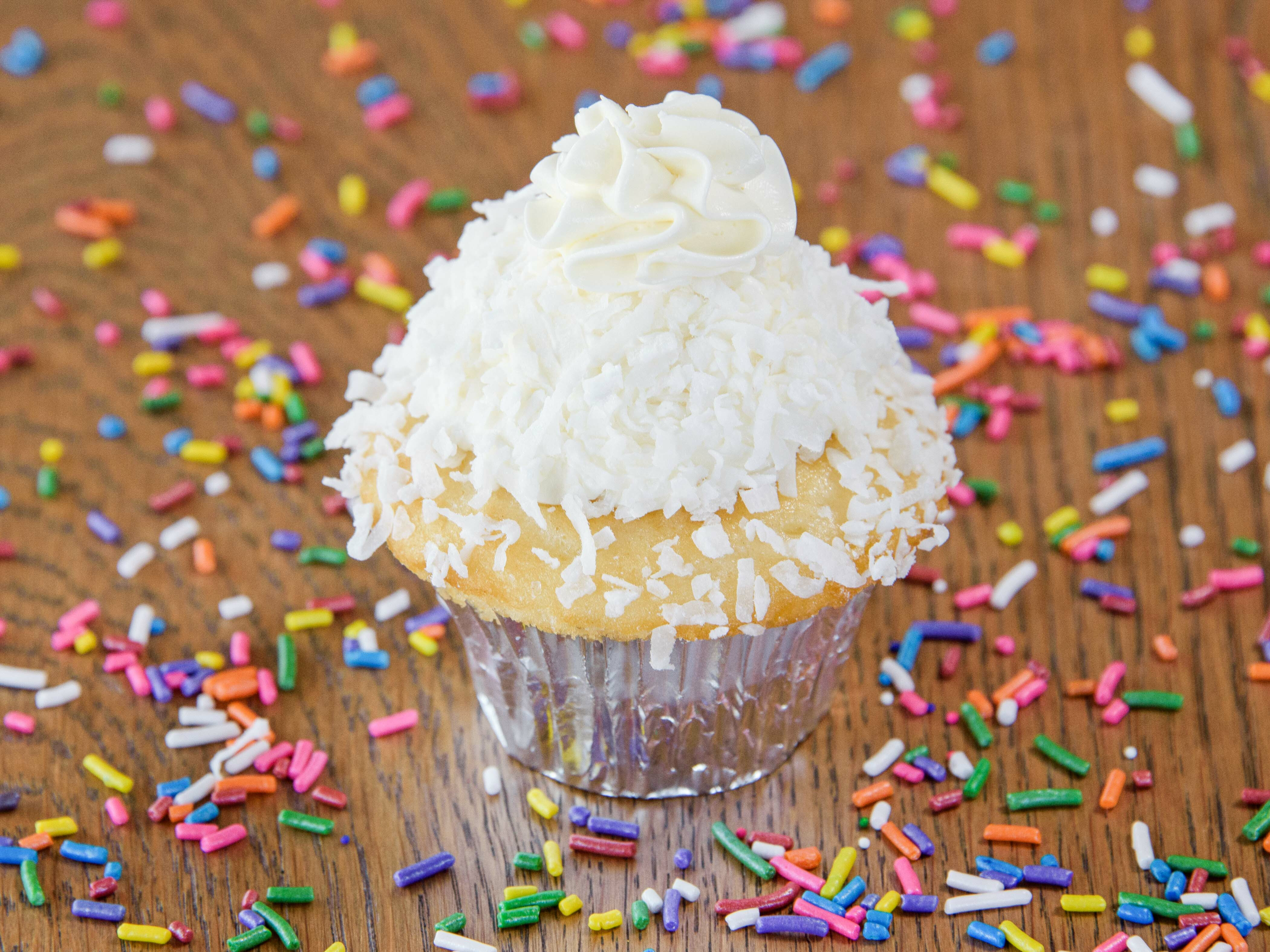 Order Coconut Cupcake food online from Simply Cakes And Cupcakes store, Mission Viejo on bringmethat.com