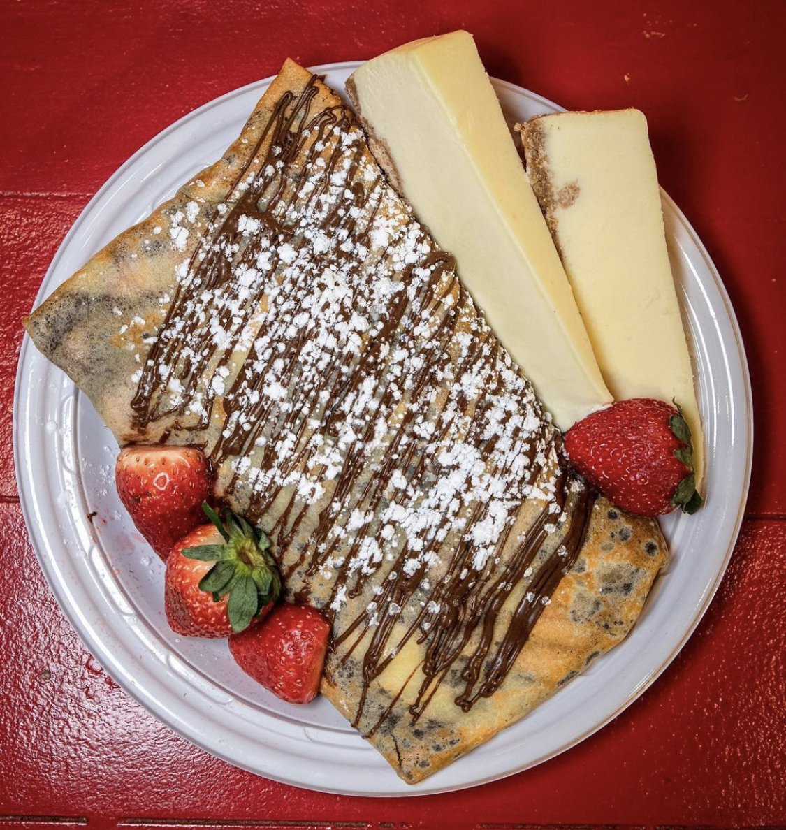 Order Cheesecake Crepe with New York Cheesecake, Fresh Strawberries, Any Chocolate and Whipped Cream. food online from Creperie store, New York on bringmethat.com