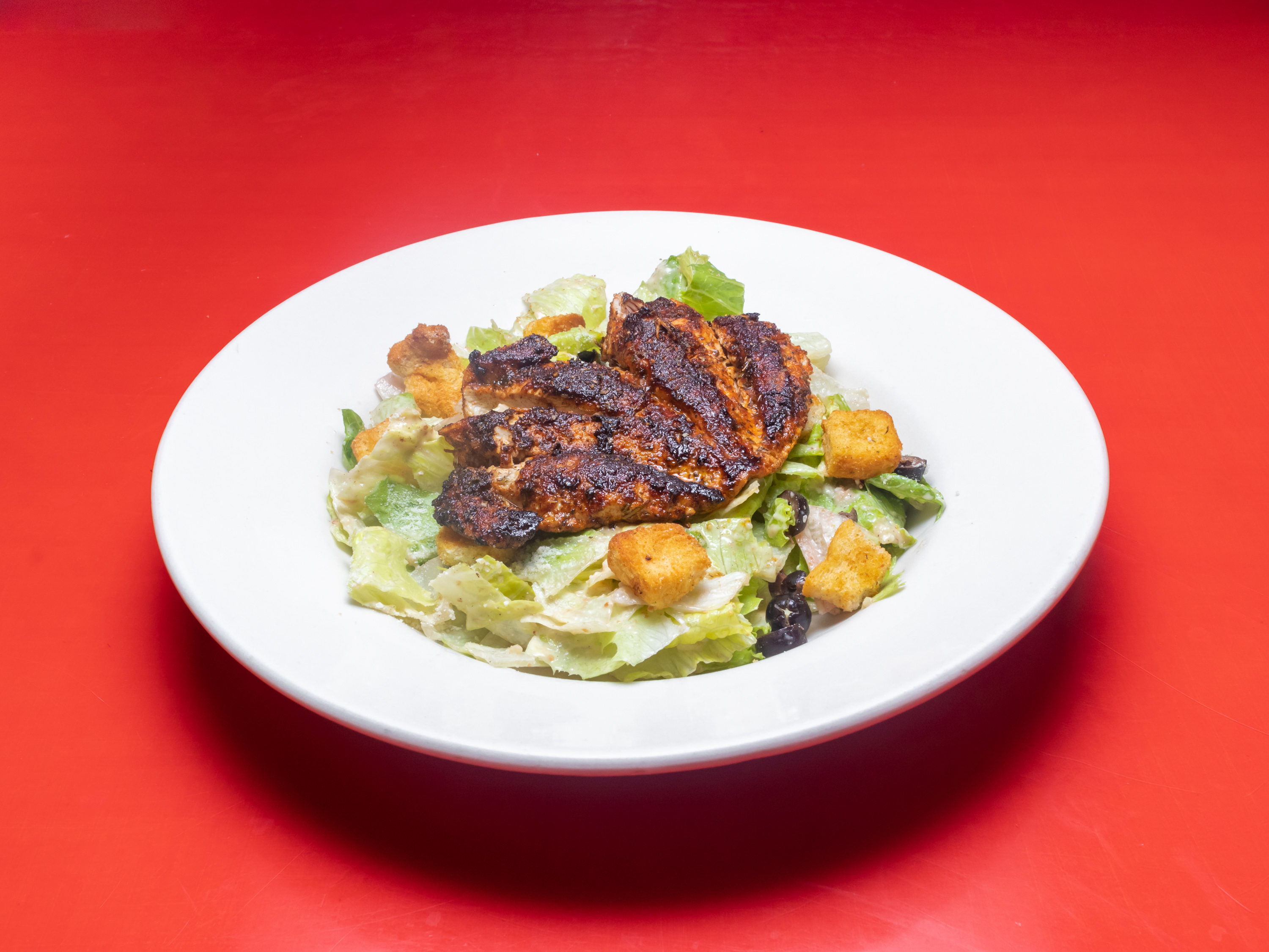 Order Chicken Caesar Salad food online from Wolfies Restaurants & Sports Bars store, Sugar Land on bringmethat.com