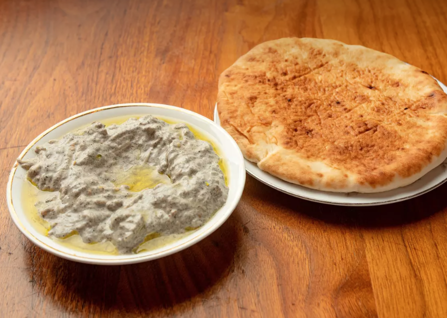 Order Babaganoush food online from Slice Of Queens store, Brooklyn on bringmethat.com