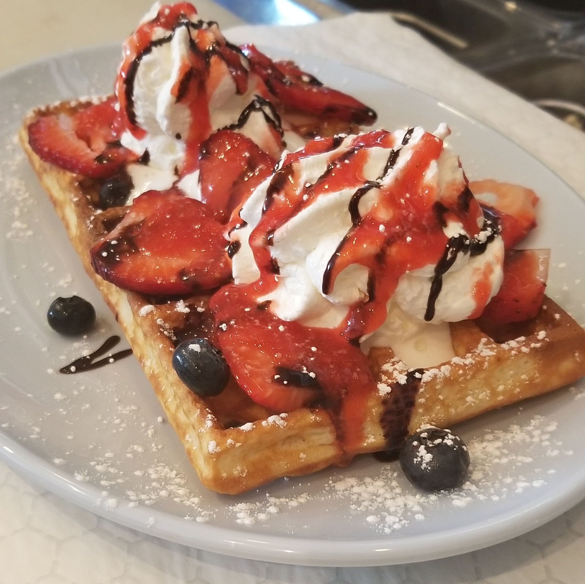Order Waffle with Sauce, Fruits and Wipped Cream food online from Highlander's Grill store, Hickory Hills on bringmethat.com