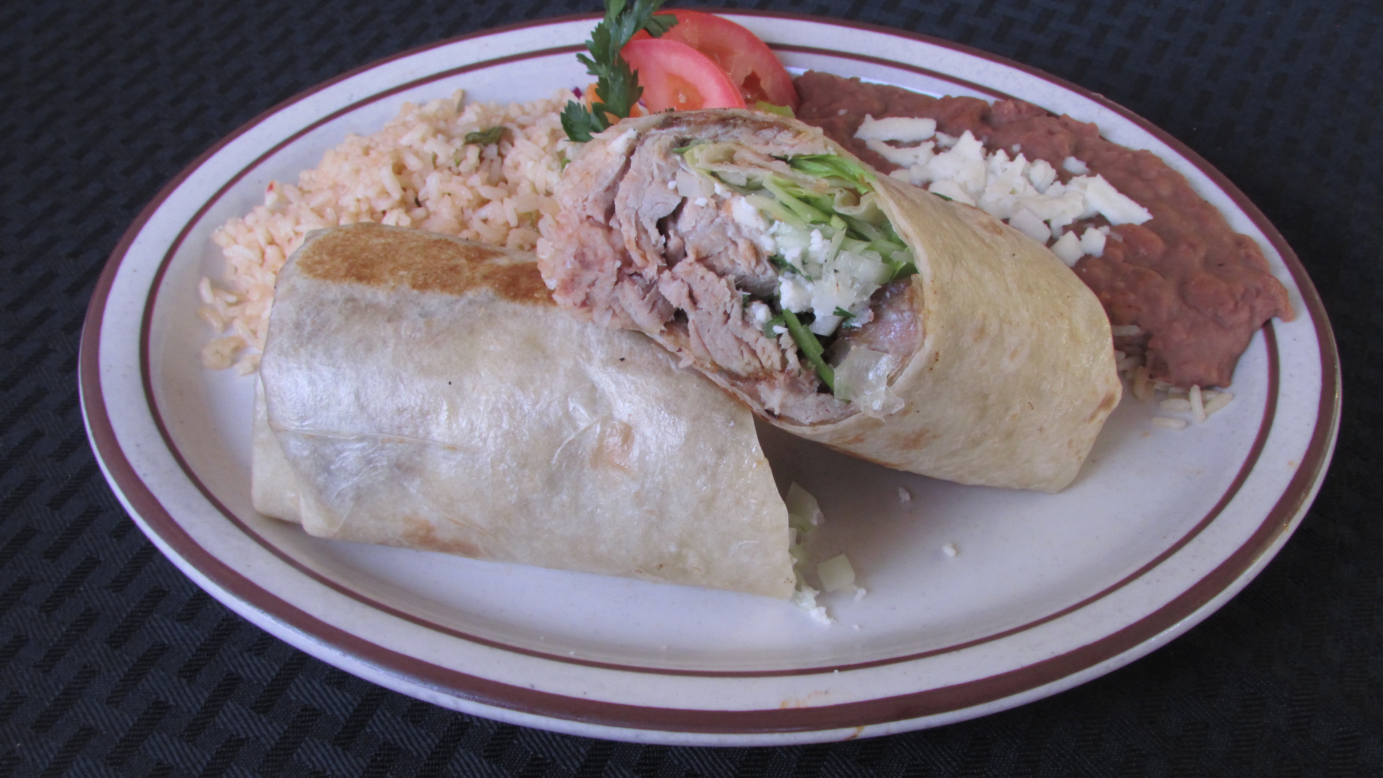 Order Carnitas Burrito food online from Tortillas Restaurant store, Cathedral City on bringmethat.com