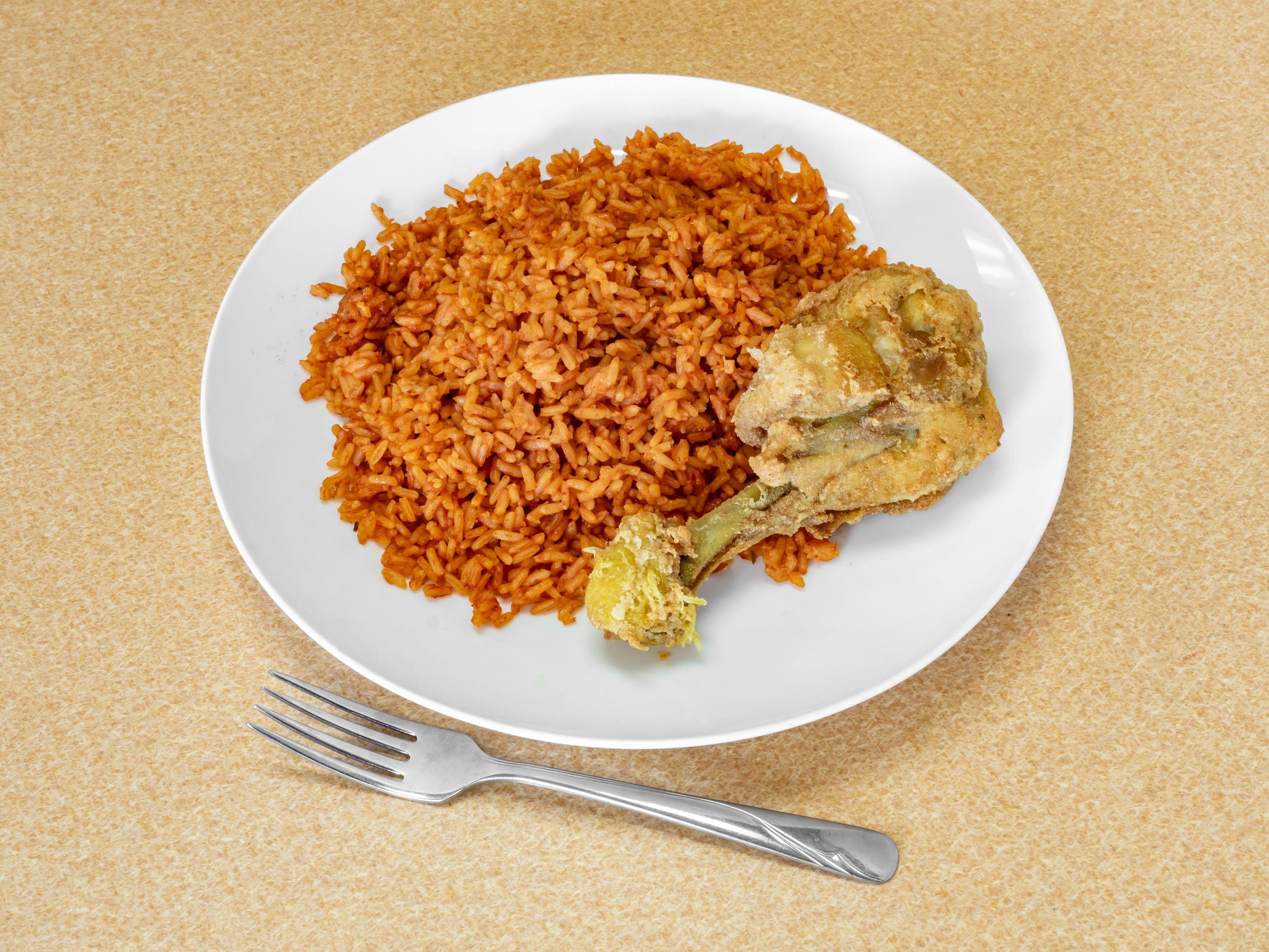 Order Jollof Rice and Chicken food online from Toni's African Deli store, Crystal on bringmethat.com