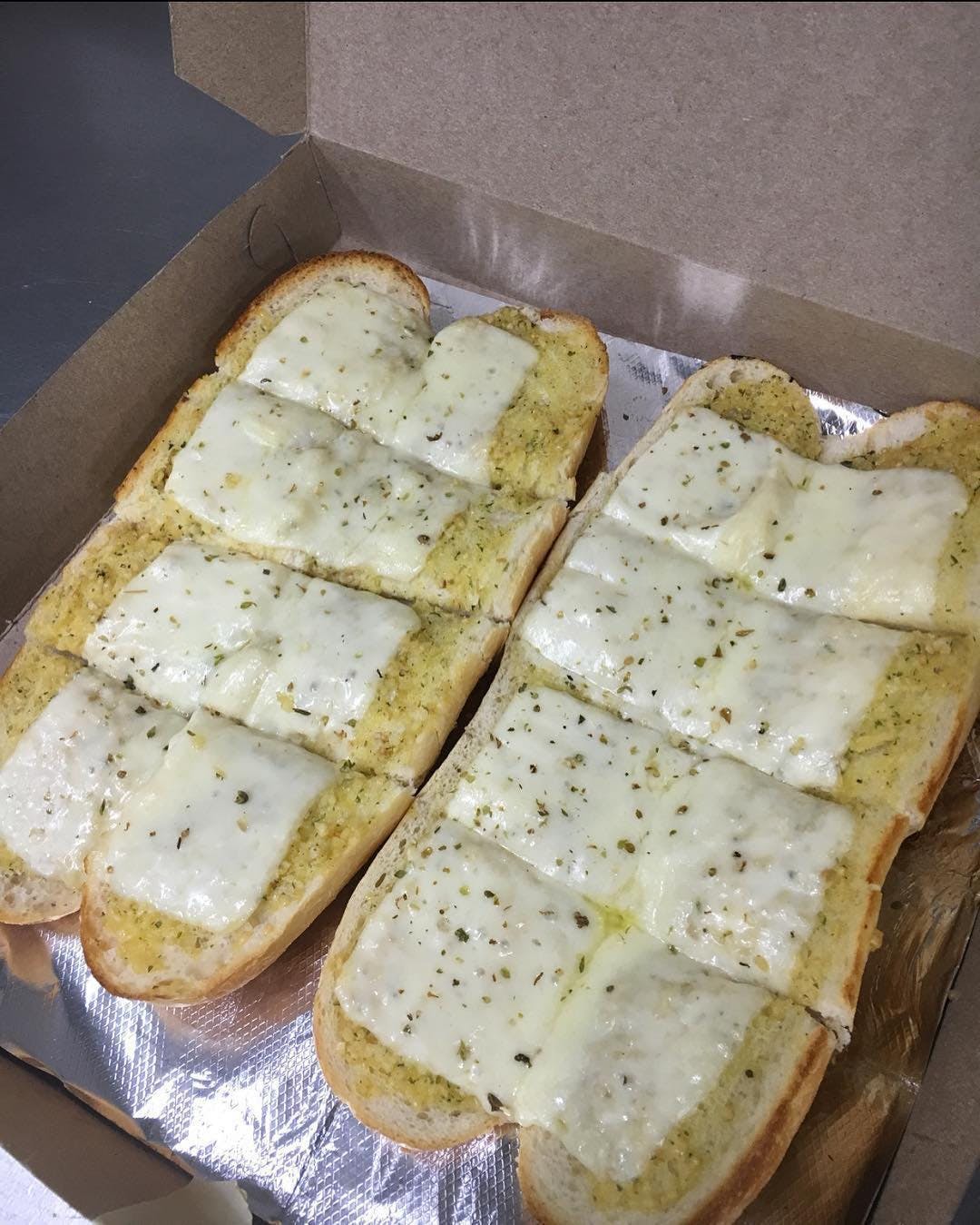 Order Garlic Bread with Melted Mozzarella - Appetizer food online from Planet Pizza store, Ridgefield on bringmethat.com