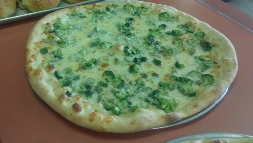 Order Spinach White Pizza - Medium 14'' food online from Maggio's Pizza & Pasta store, Woodbury on bringmethat.com