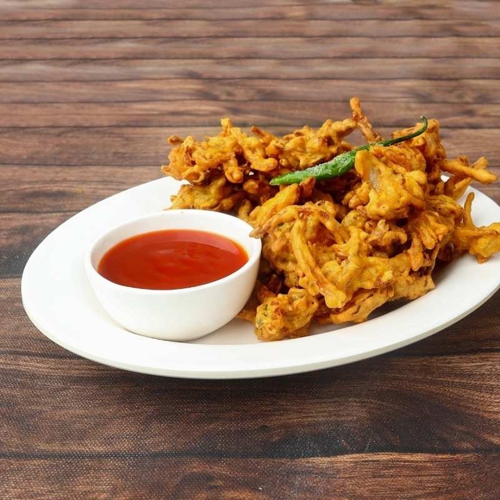 Order Crispy Onion Pakoda food online from Madras Cafe store, San Diego on bringmethat.com