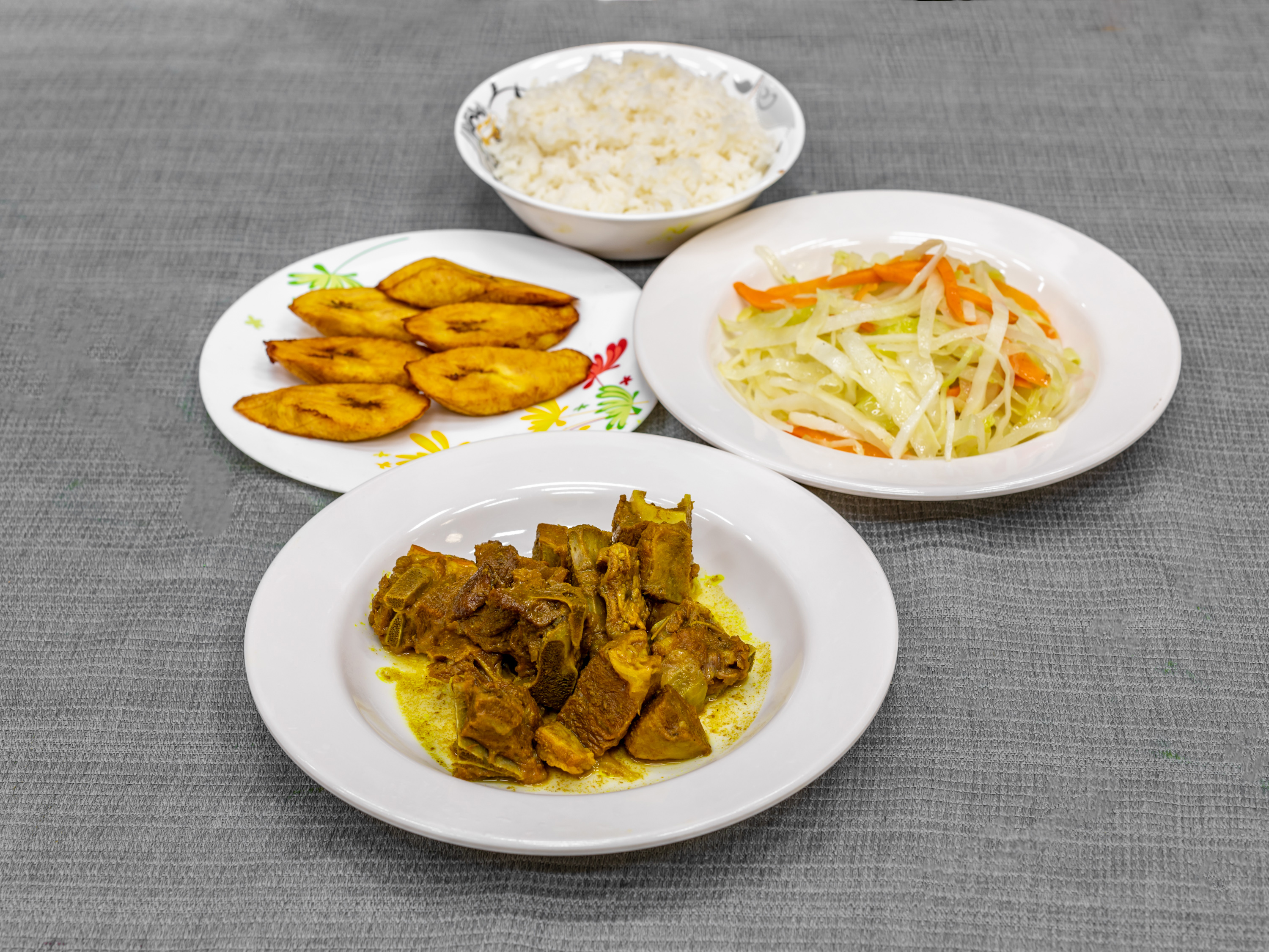 Order Curry Goat food online from Caggy Hotspot Restaurant store, Yonkers on bringmethat.com